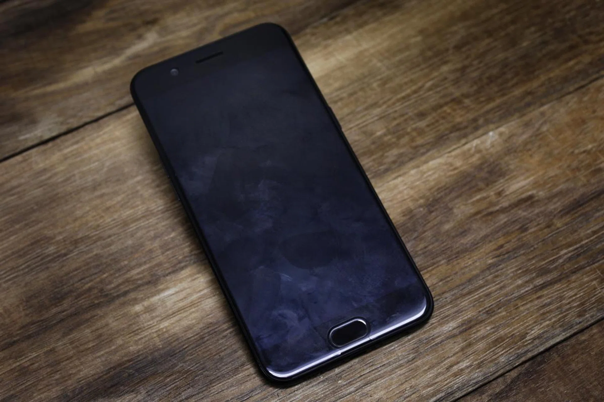 The factory installed screen protector is a real fingerprint magnet, but it could be even worse without it.