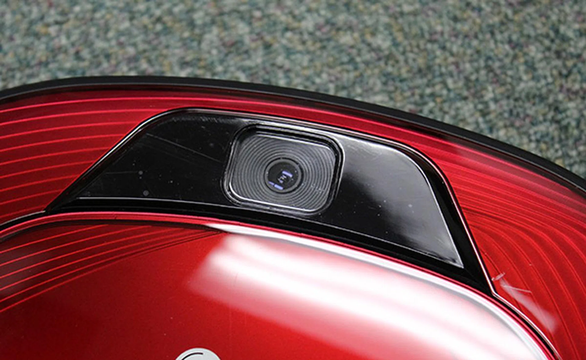 The top-facing camera takes as many as 30 photos per second to help it find its coordinates in a room.