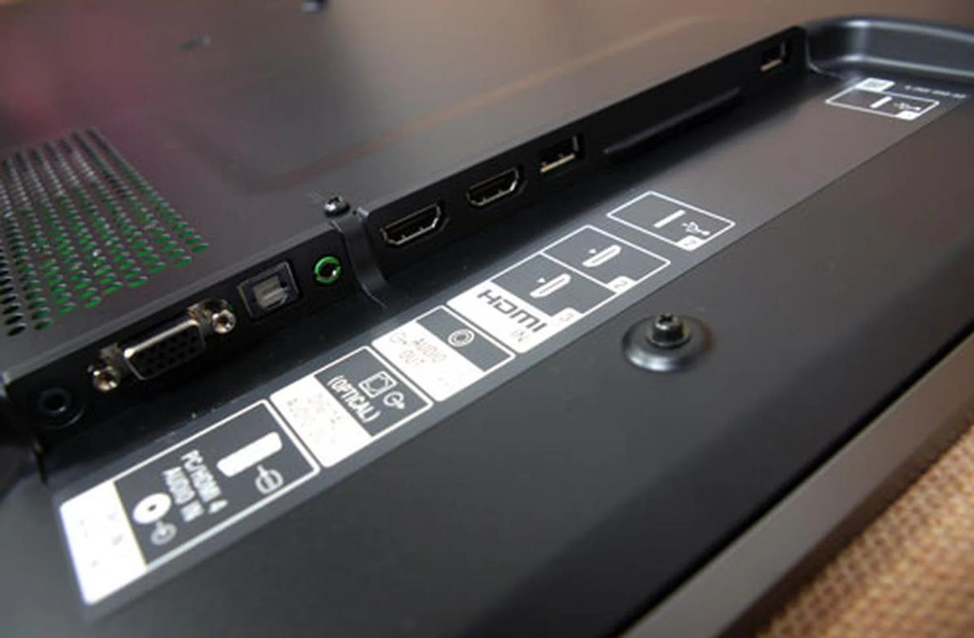 Commonly used IO terminals are found on the side panel, which include two USB slots, two HDMI 1.4a ports, and a VGA PC input. Audio selections such as an optical and a headphone output are featured here as well. The side panel isn't too deeply recessed which makes it fairly easy to access.