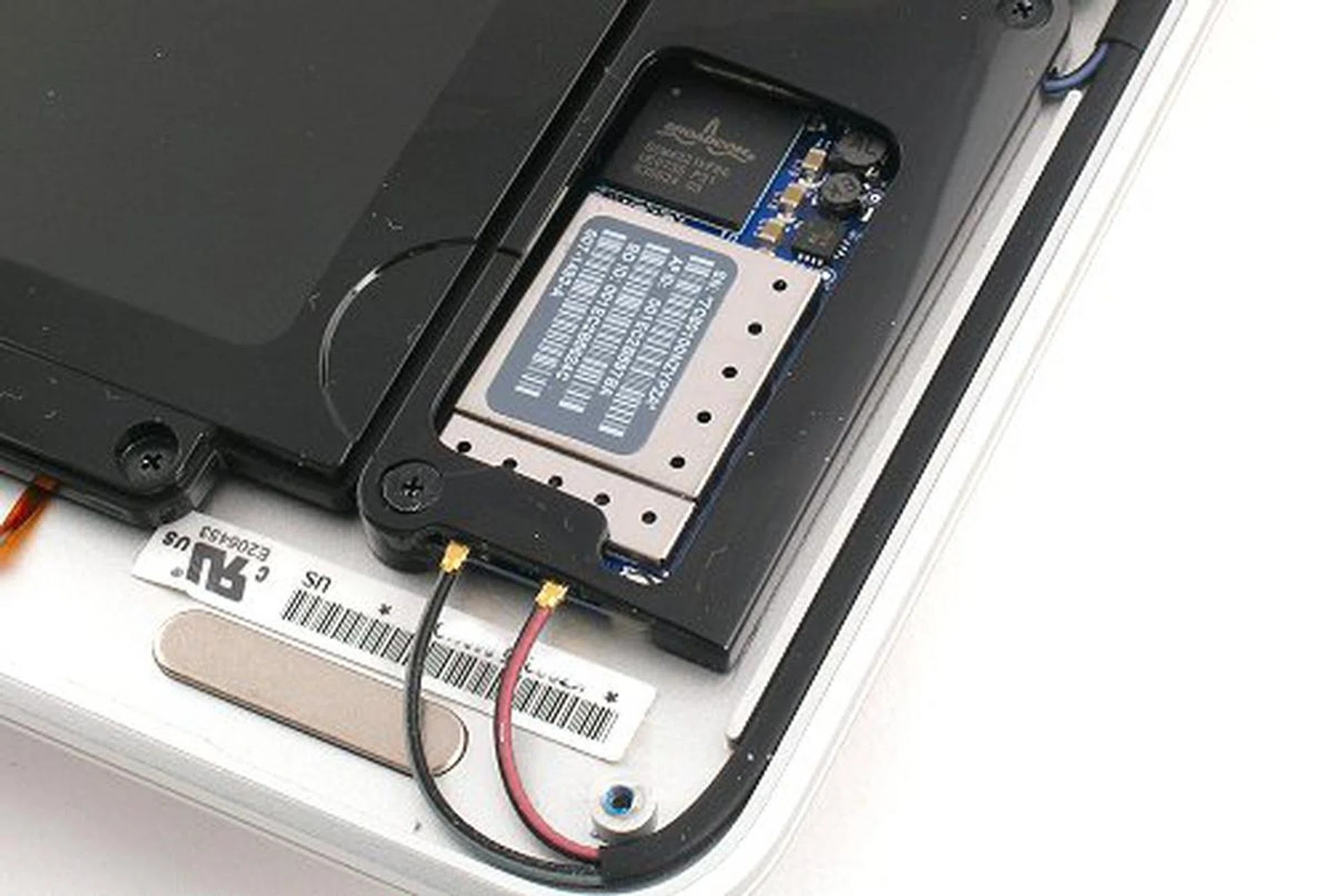 On the bottom front, we've got the AirPort installation. The Broadcom intensi-fi chip can be seen above powering the Draft-N wireless AirPort.