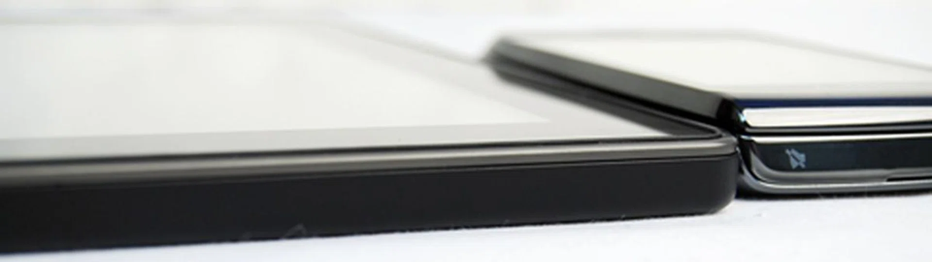 The PlayBook (left) is thinner than the BlackBerry Torch (right), making it a truly portable device for people on-the-go.