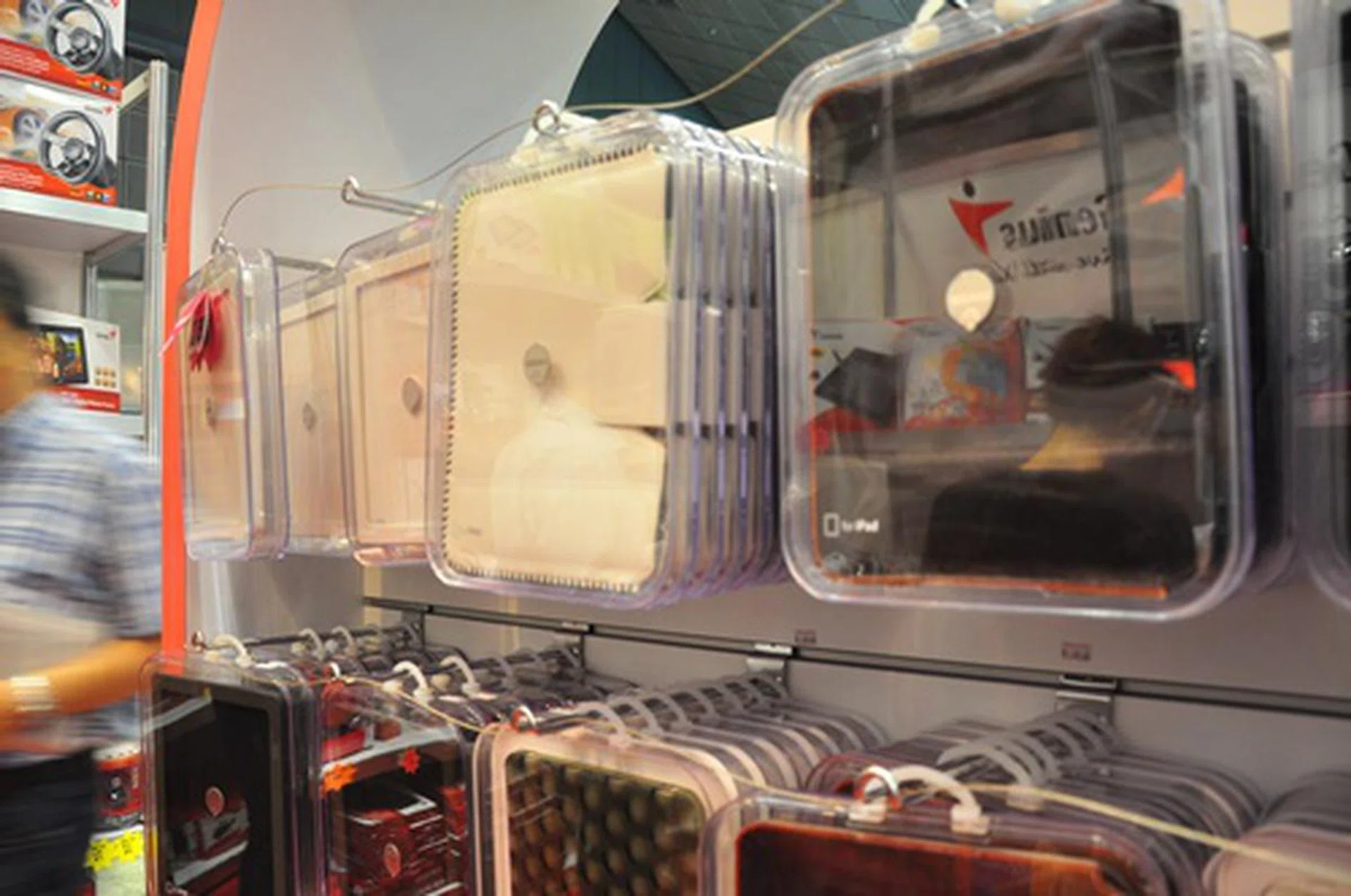 The Ozaki booth is a tablet owner's heaven. If you are looking for a good deal for iPad covers, we suggest getting the Ozaki iCoat Sew Leather Sleeve (Brown), which retails for $30 and comes with a free iStroke strap stylus (priced at $28).