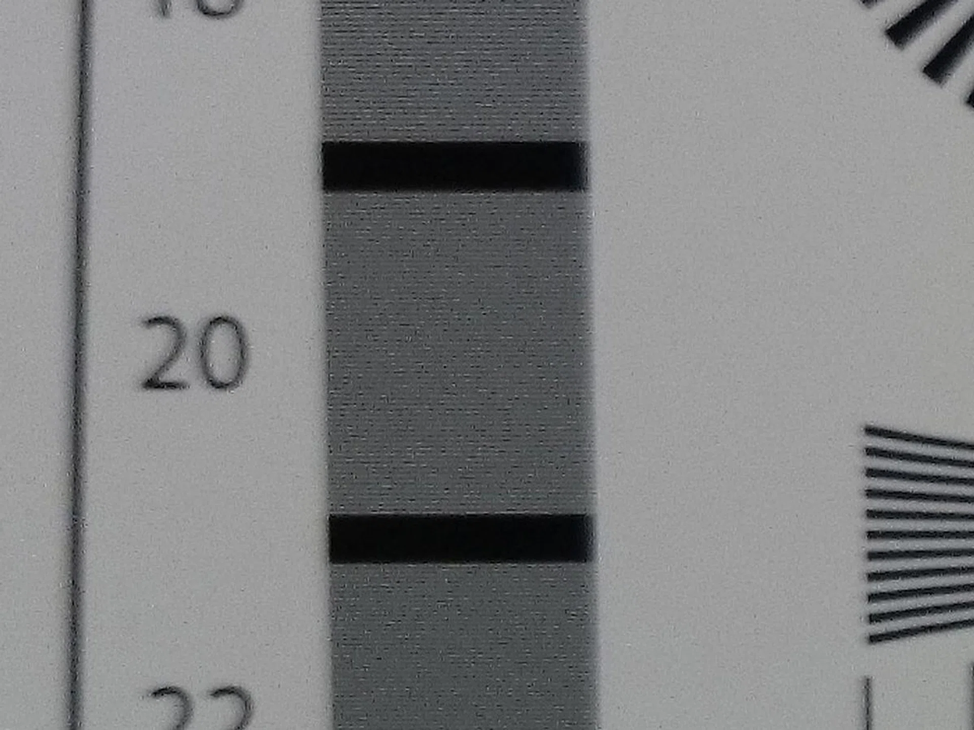 Sony Z1, 20MP, 100% crop. The software update can't correct for the lens' softness, which is a hardware problem.