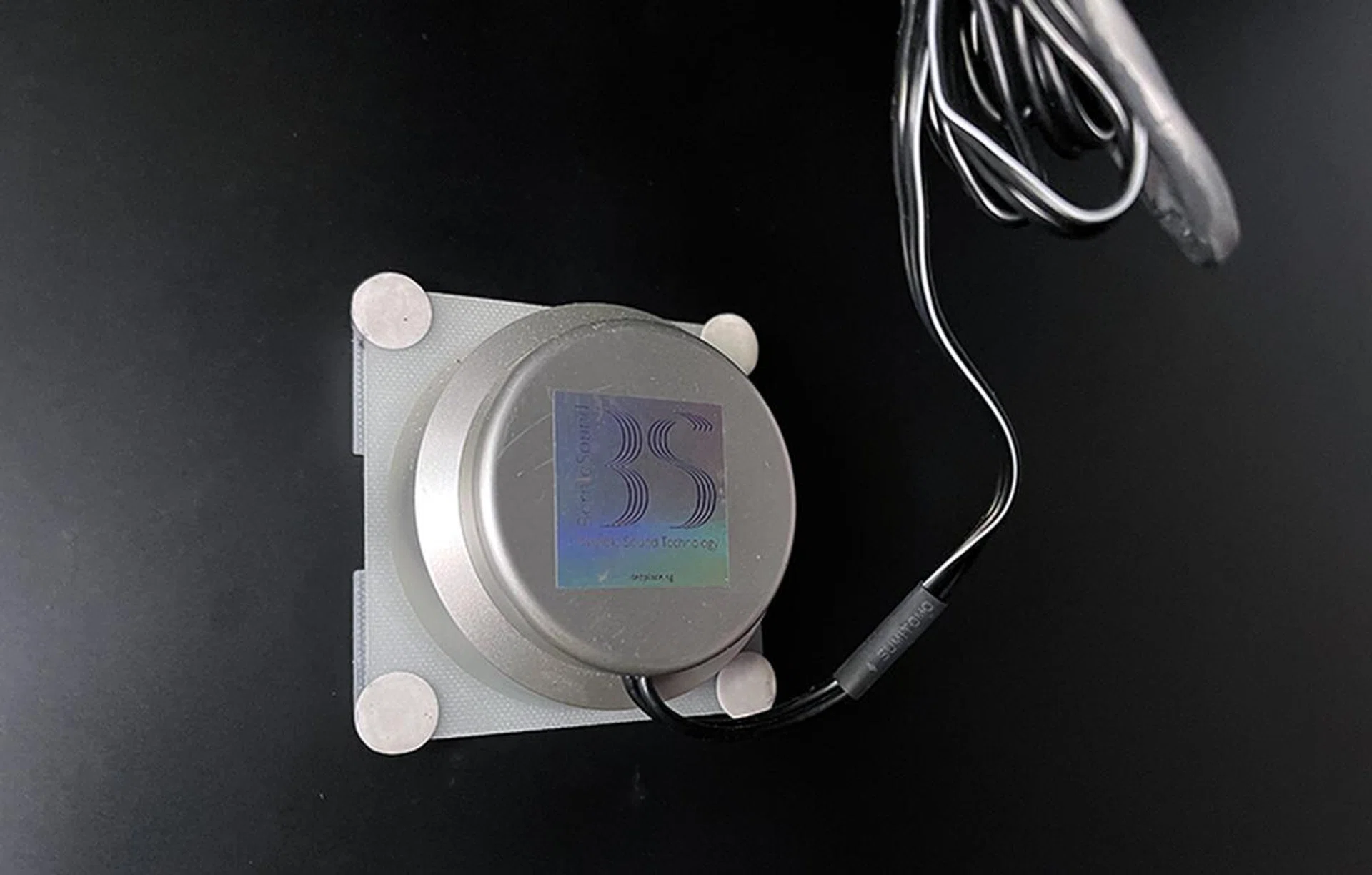 One VST30 is attached to a false wall that's doubling up as a hidden vibration speaker for Wine Connection's patrons.