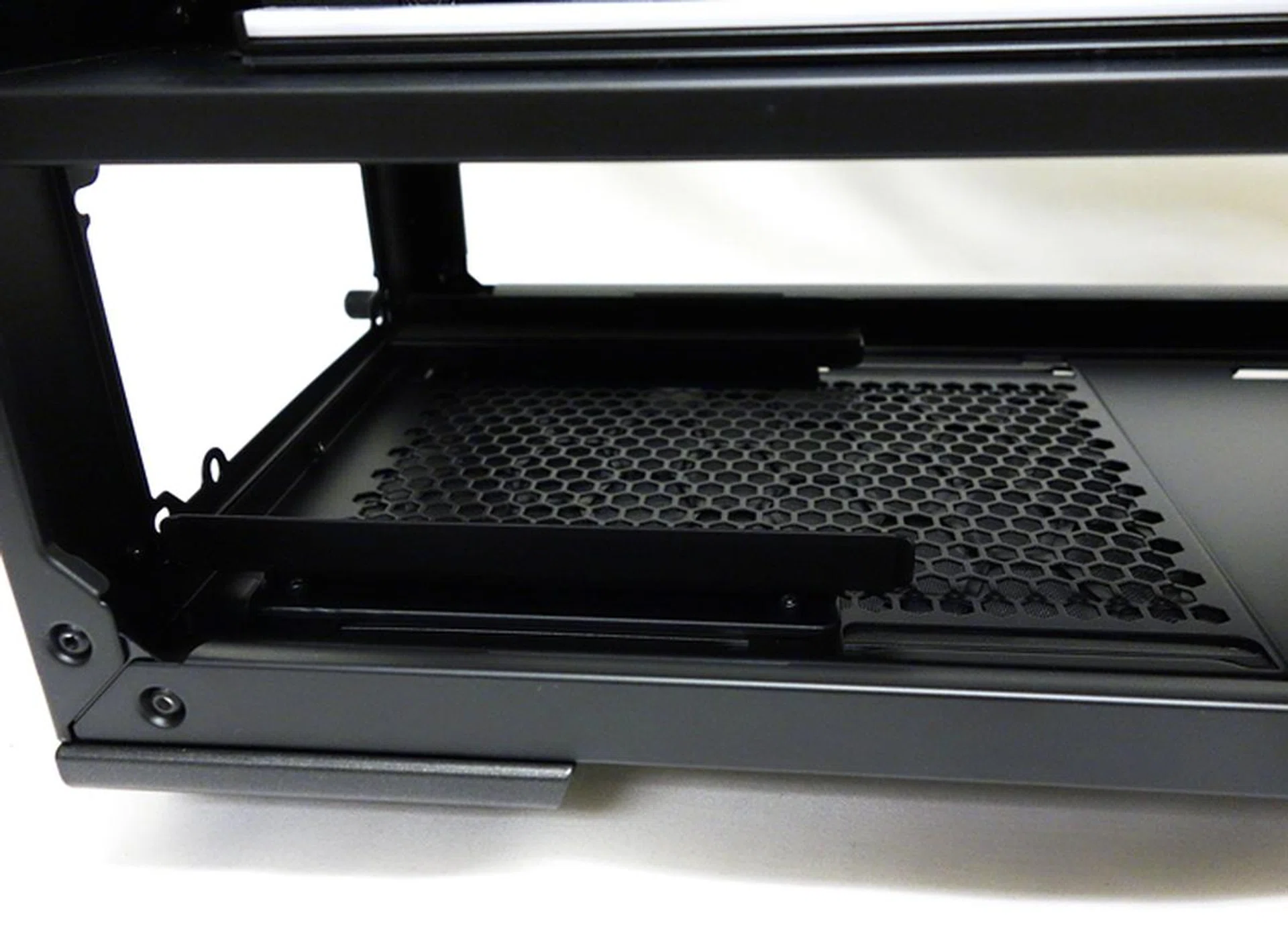 The supported ATX PSU slides in from the rear and there are bottom air vents for the cooling outlet fan of the installed PSU.