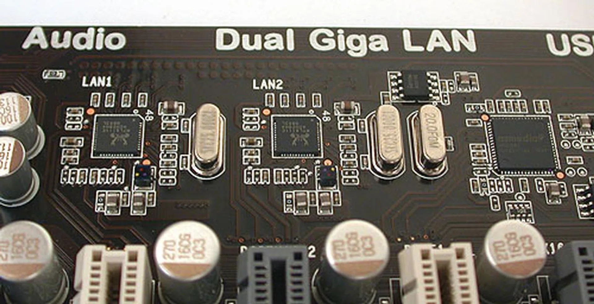 As the printing on the PCB says, there are two Gigabit LAN controllers on board, along with a USB 3.0 controller from ASMedia (an ASUS subsidiary interestingly) and the ubiquitous Realtek audio chip.