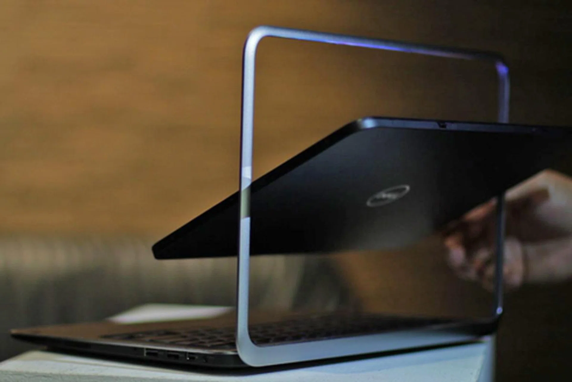 By swiveling the screen around inside its frame...