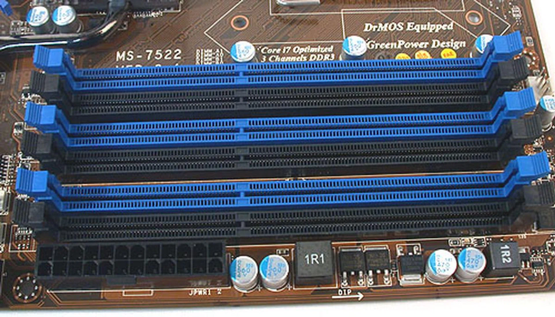 Six full rows of DIMM slots, color coordinated for triple channel memory kits. A possible grouse for those using memory modules with larger, protruding heat spreaders or coolers is the proximity of the ATX power connector to one of the DIMM slots. Other than that, we were surprised not to find MSI compromising the quantity of DIMM slots.