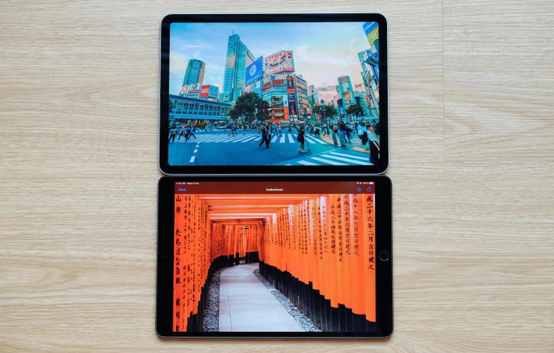 The new iPad Air above and last year's iPad Air below. The bezels are thinner and the Home button is gone. The display is also slightly bigger.