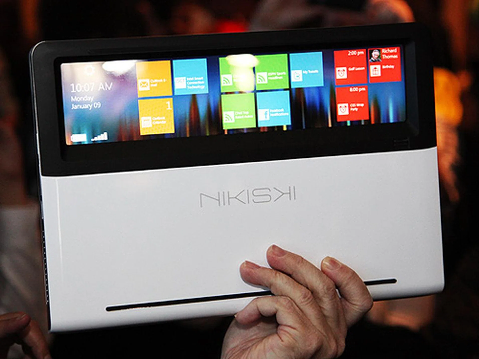 A working model of Intel's concept Ultrabook codenamed Nikiski. When the Ultrabook is closed, the clear touch panel allows you see part of the screen, allowing the user to quickly access information without opening the laptop.