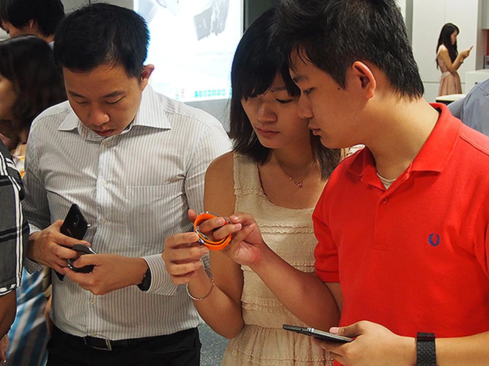 Users testing the Galaxy Gear smart watch.