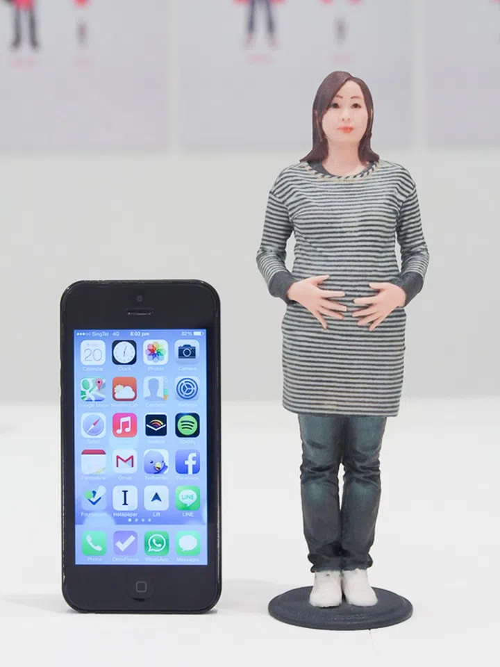 Here's one figurine next to an iPhone 5 for a sense of scale.