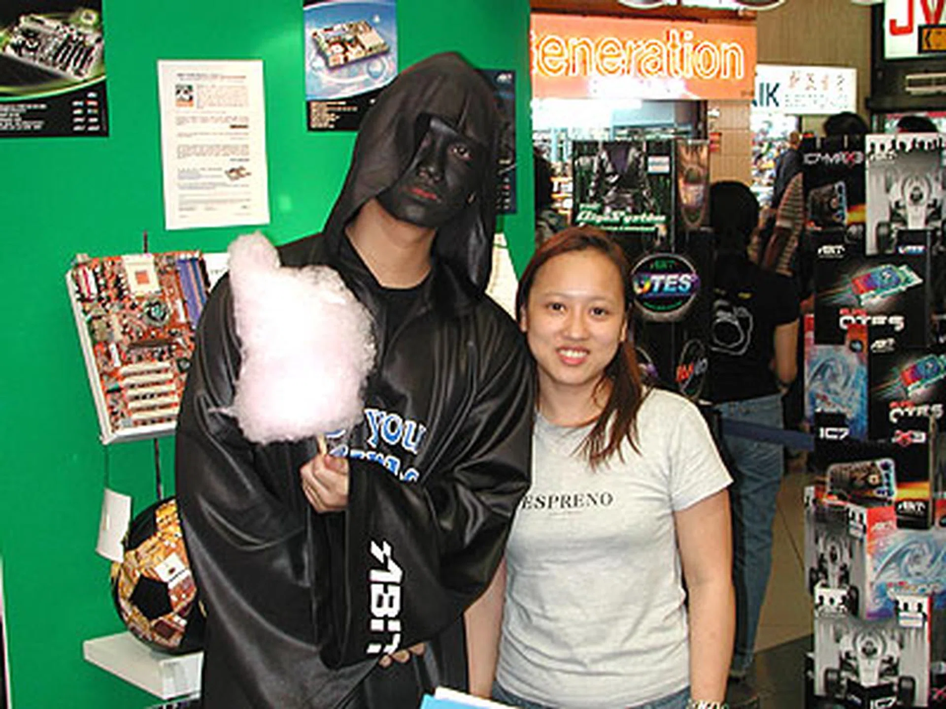ABIT's µGuru mascot was there to grace the event. Seen here posing at the ABIT booth with a Convergent staff and... ermm.. candy floss?