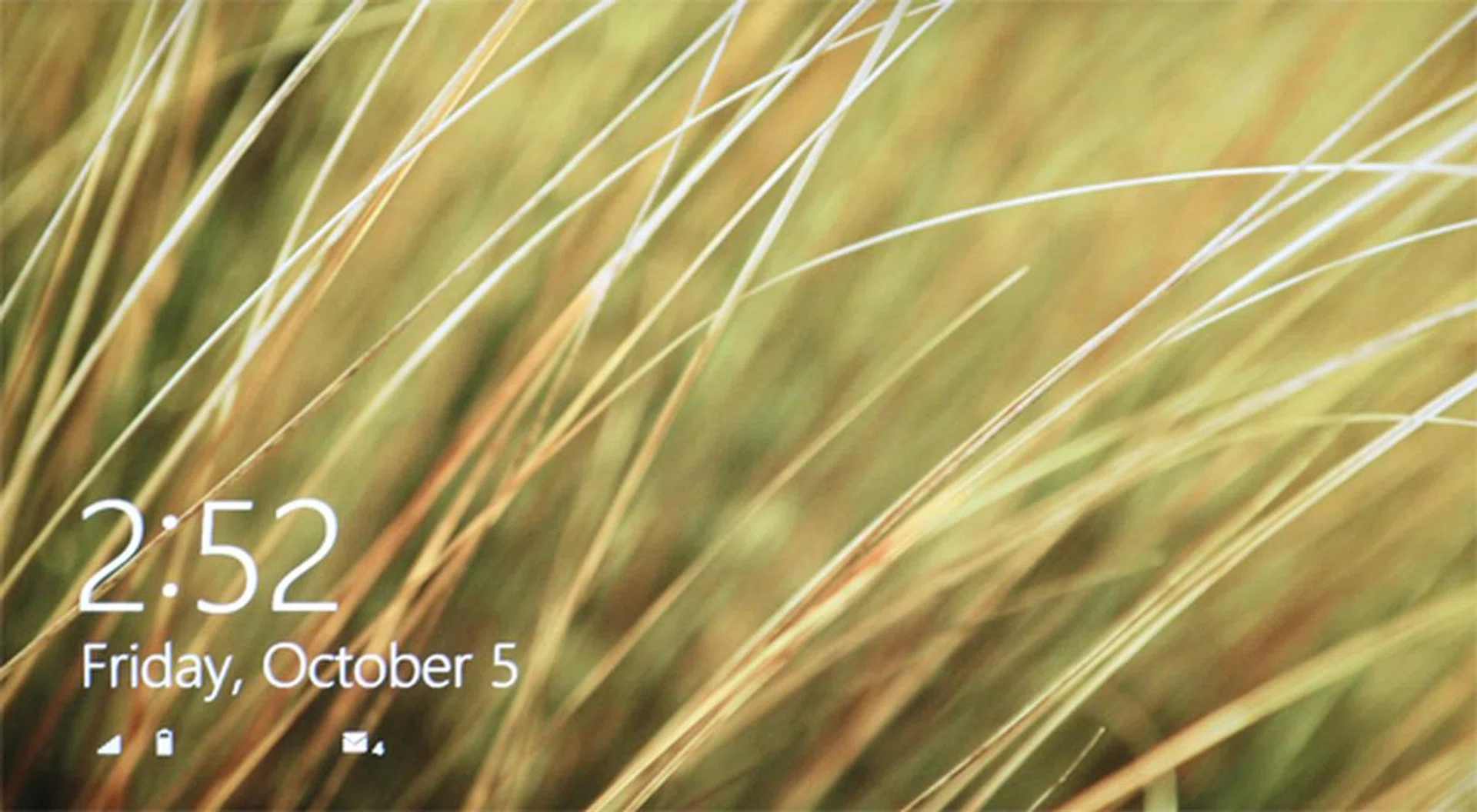 Place your finger anywhere on the screen, and slide upward to get past the lock screen. If you're using a mouse, just do a left click.