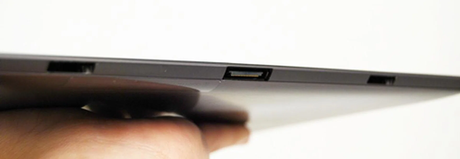 You will find the two latches flanking the proprietary connector at the bottom. As there is no microUSB port present, you can only charge the tablet via the proprietary cable or via its optional keyboard dock station which doubles as an external battery pack. The two latches secure the Transformer Prime to the keyboard docking station, which we will share more in the following page.
