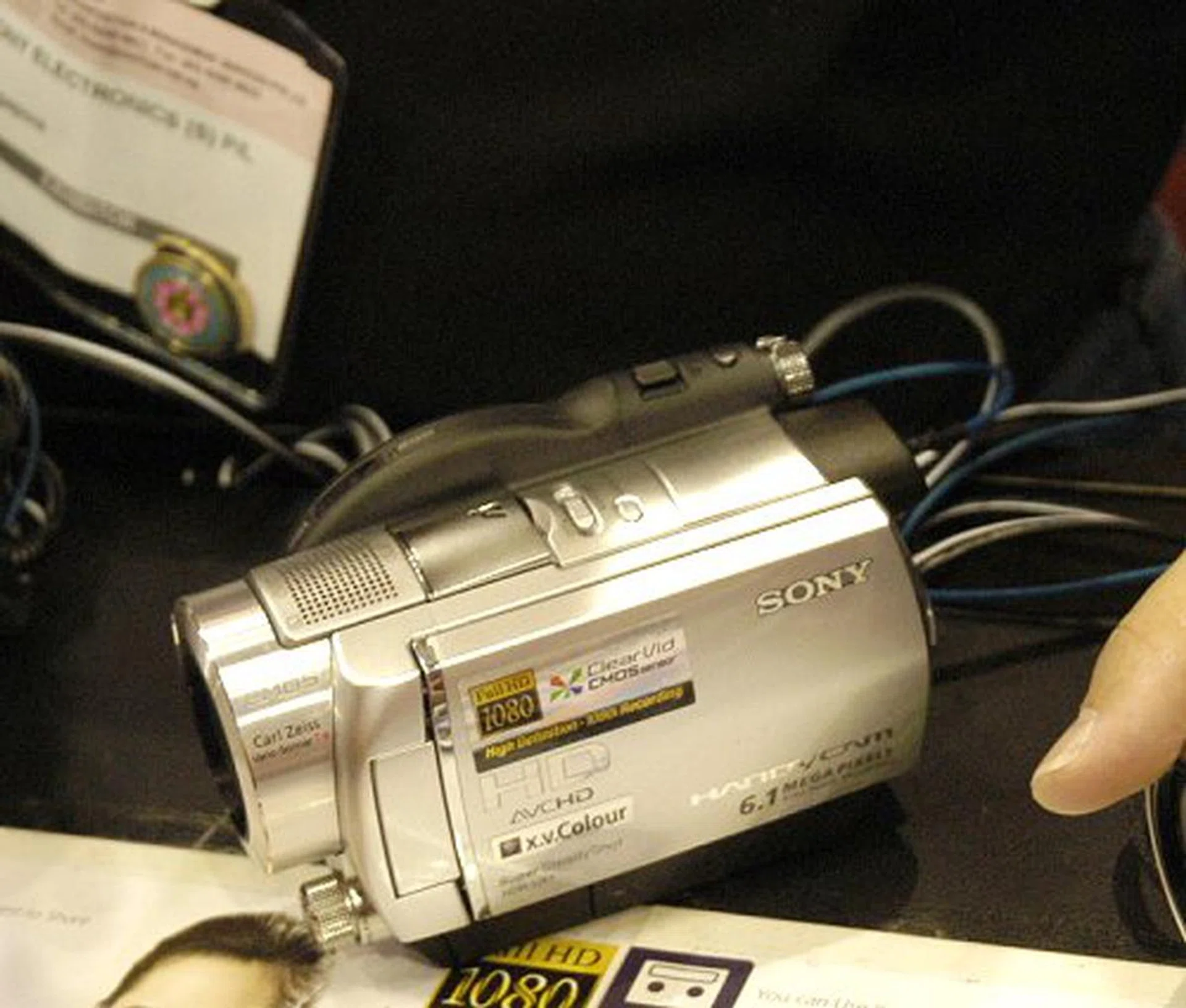  The higher end model, the HDR-UX7E boasts a 6,1 megapixel camera and a larger screen. The cost is also higher at $2499.  