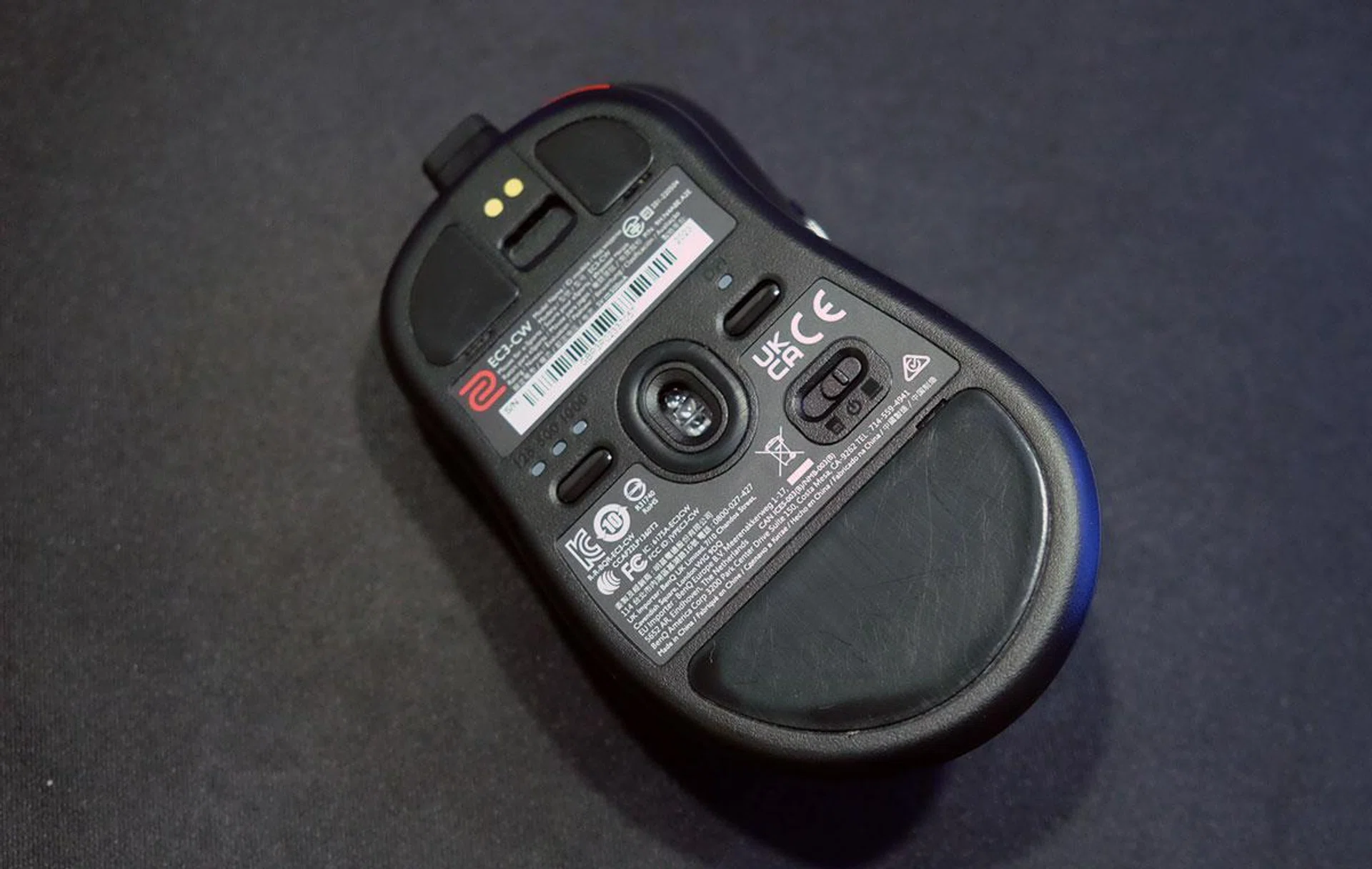 You toggle between the Enhanced Receiver and the dongle using a switch at the bottom of the mouse. 