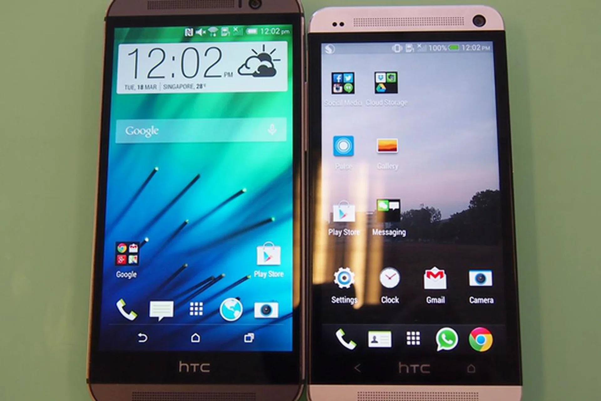 The HTC One (M8) retains some aspects of its design language from its predecessor (right) and the front-facing BoomSound speakers. Improved is the slimmer 'bezel' and its soft keys. Say goodbye to the dreaded fixed touch keys of the former HTC One series.