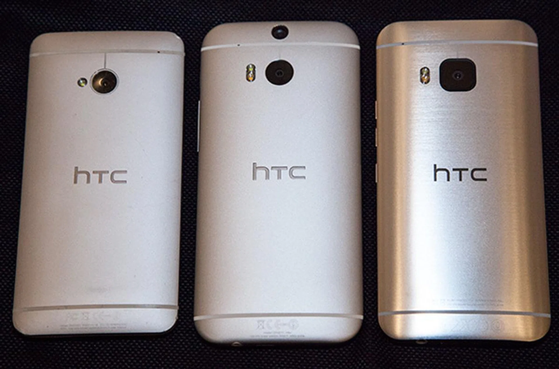 The back of the HTC One M7 to M9 (left to right) shows the evolution of the chassis' construction and finishing.