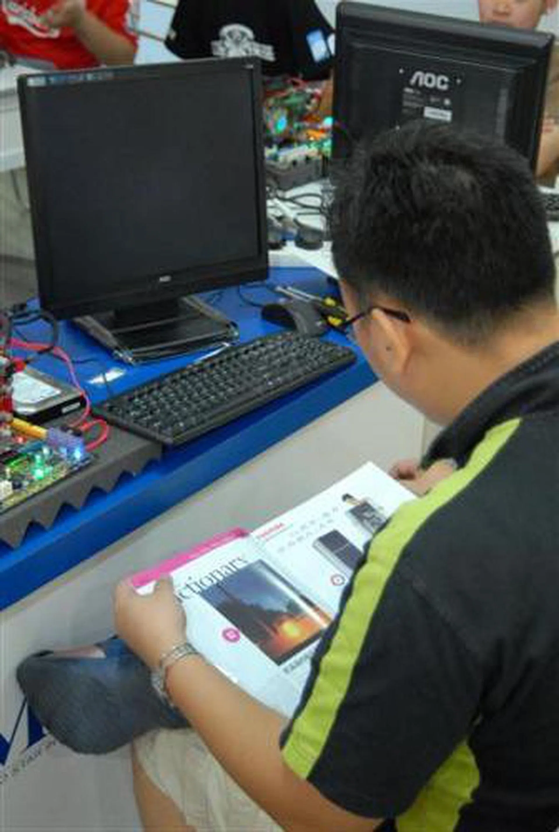  Storm88 took out a few minutes of waiting time by reading a travel magazine.  