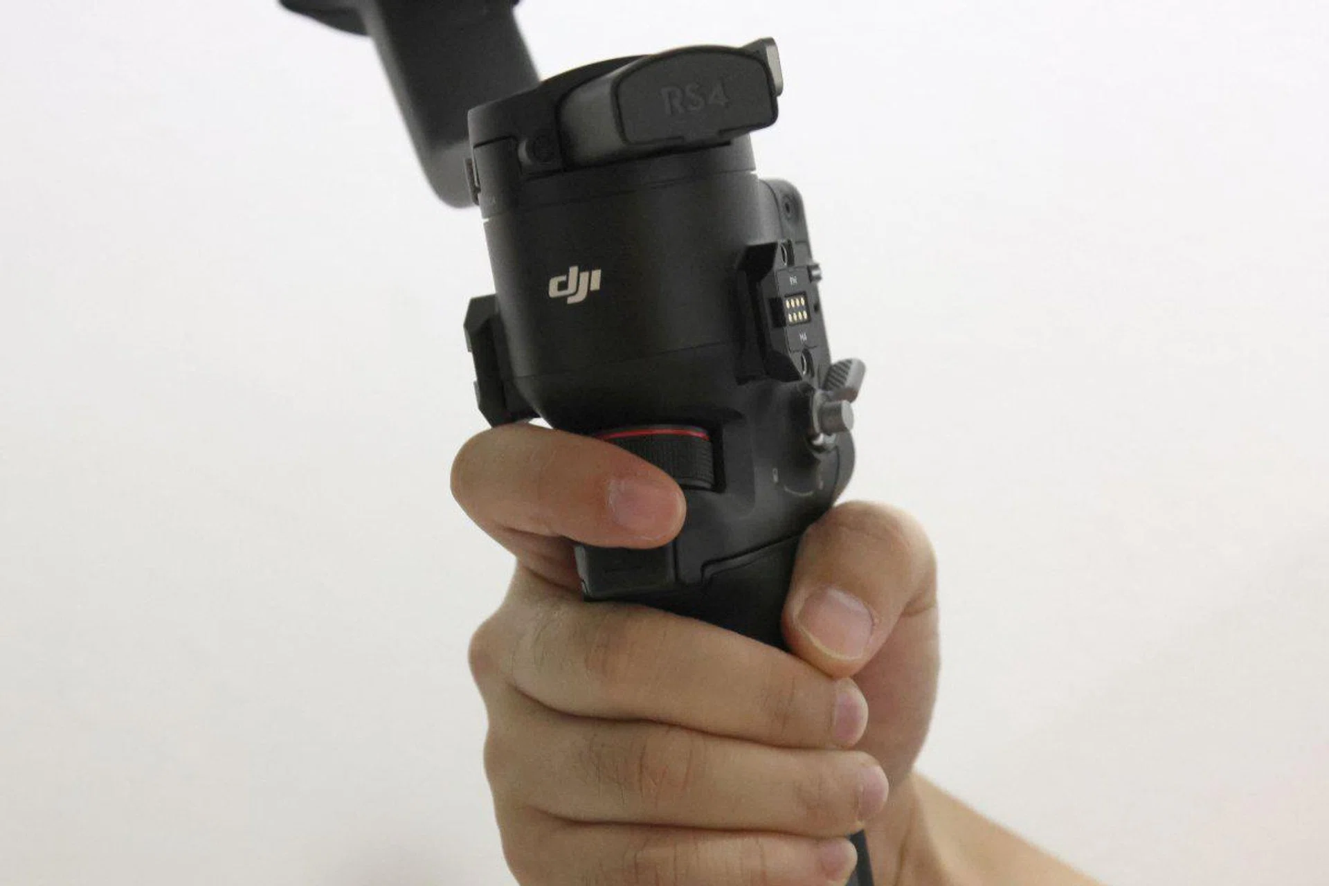 There is a trigger and a control wheel in front of the gimbal.