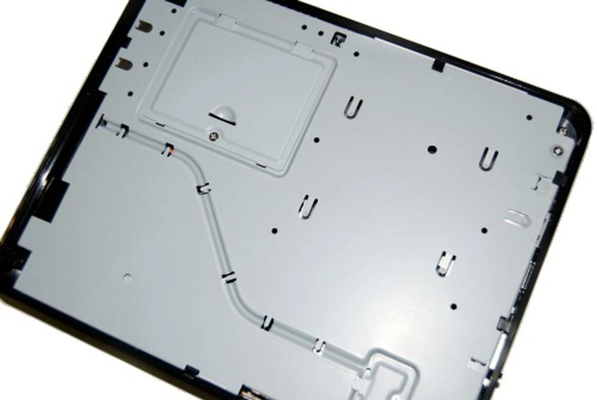 After removing the cover, you'll end up looking at this view, which was as far as we could get without damaging the Eee Box.