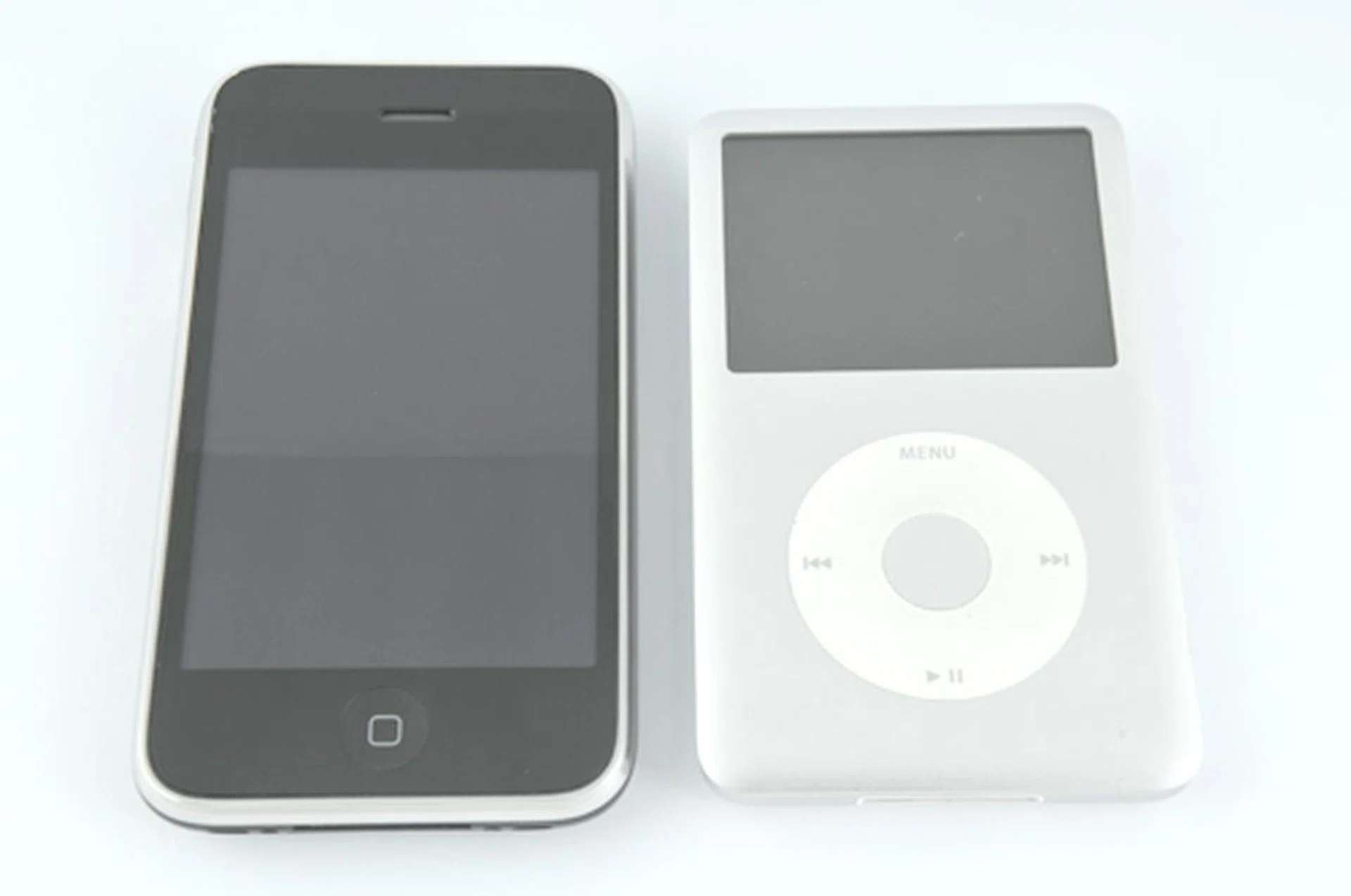 The iPhone 3G alongside its musical companion sibling, the iPod.