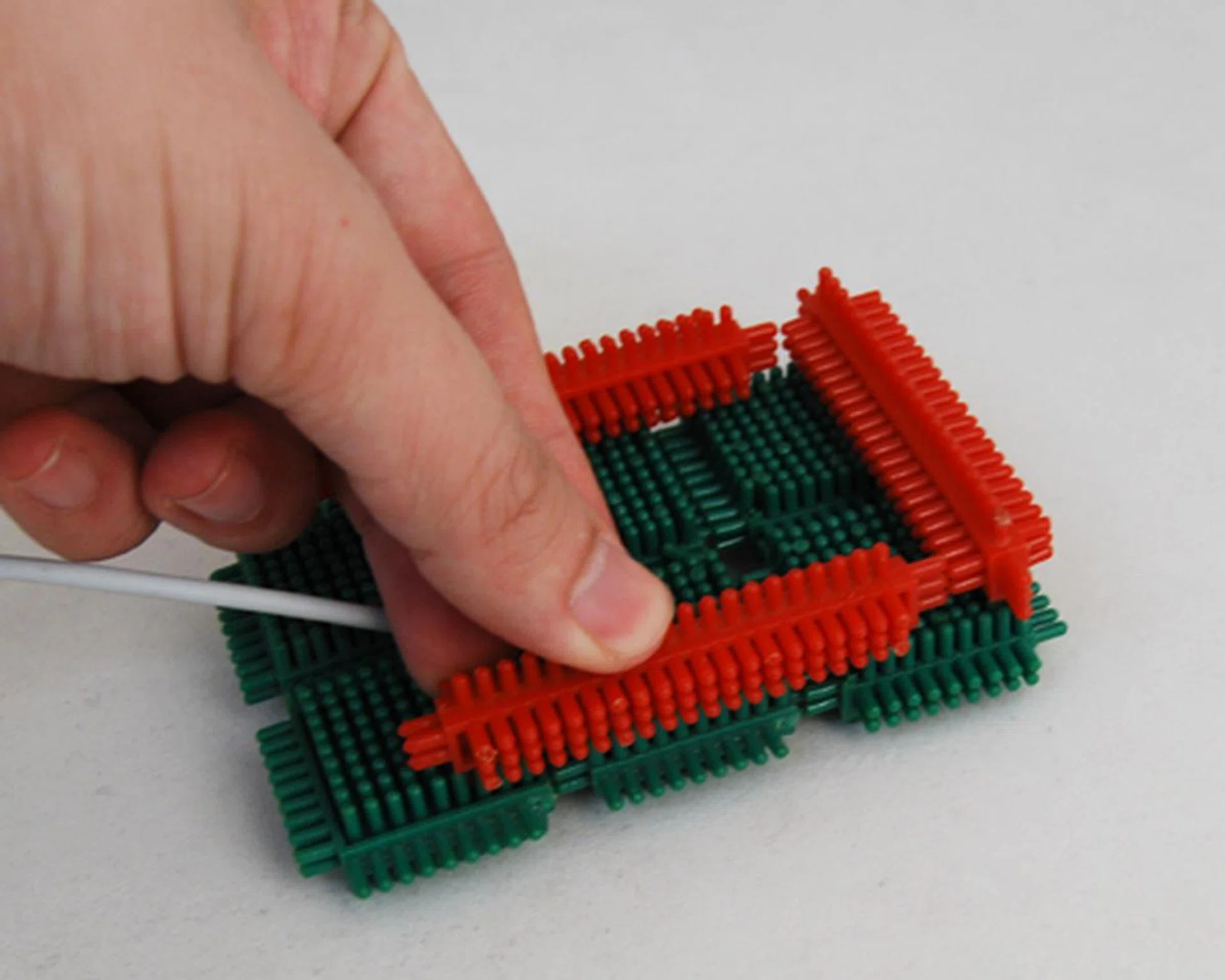 Secure the base with a secondary layer of blocks to prevent it from falling apart after repeated docking.