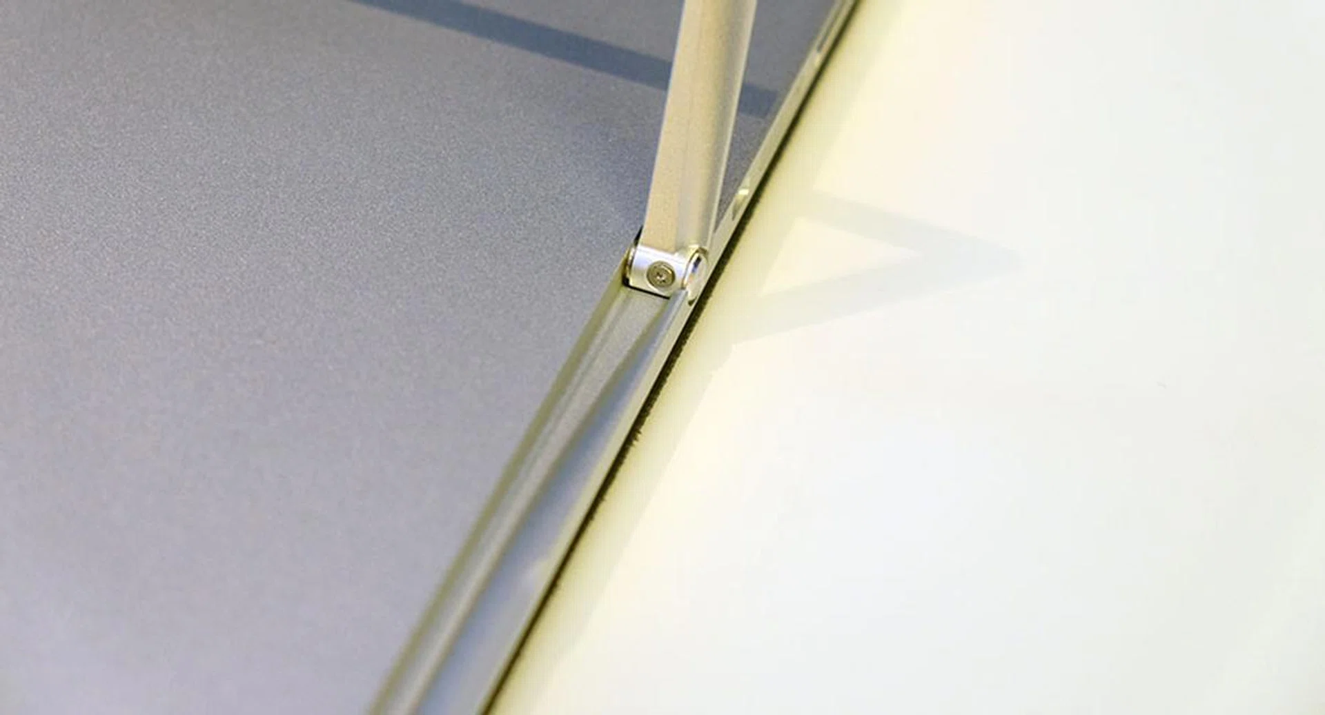 The kickstand sits in a groove of its own, adding absolutely nothing to the Elite x2's dimensions.