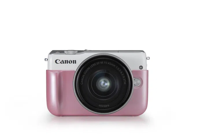 Canon EOS M10 in white, with pink jacket.