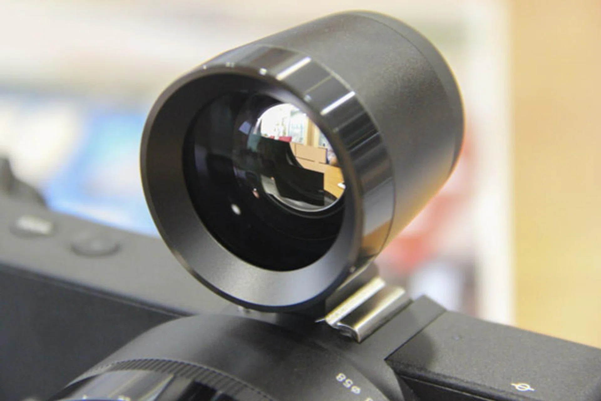 The optical viewfinder isn't synced to your LCD, but it allows you to see what the camera sees.