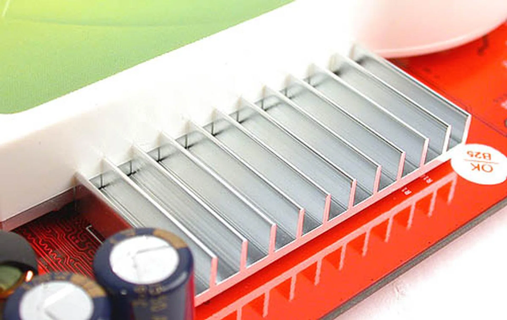 The heatsinks for the 1.2ns rated memory chips are the reason why the XpertVision is capable of its default clock speeds of 1500MHz DDR.