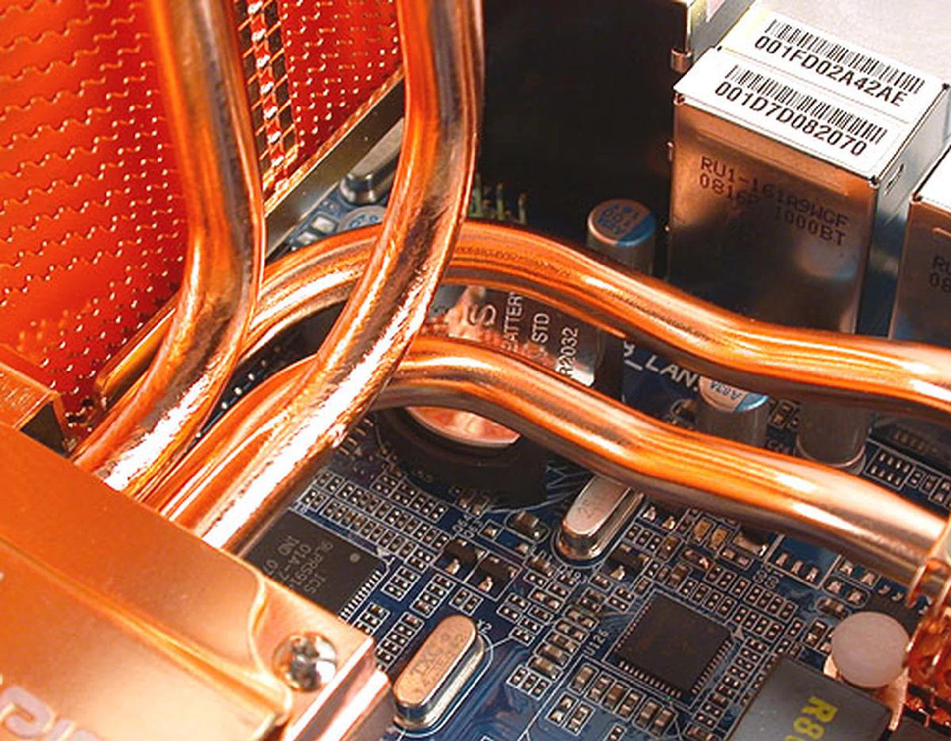 While it's quite unlikely that you'll need to remove the CMOS battery, it's also buried under all the piping that removing it is not as easy as you would think. 