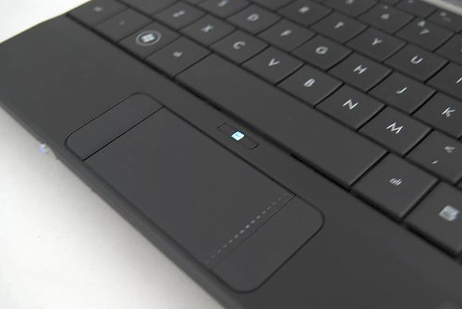 The trackpad has been improved somewhat - there's no longer a gap between the buttons and the sensitivity hasn't changed one bit.