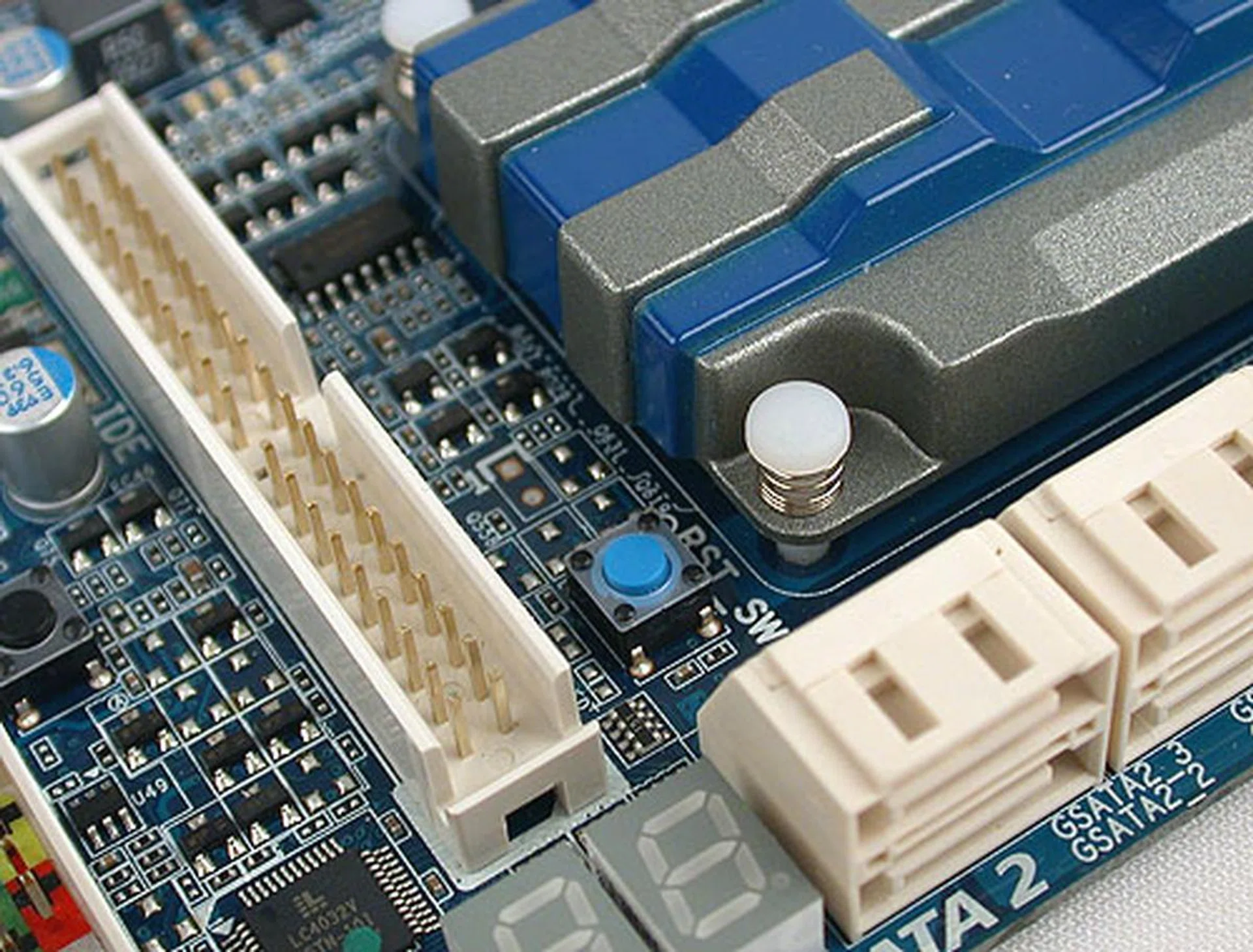 It could be a bit hard getting to the reset switch with it buried among other components here. But besides some minor layout issues, this Gigabyte board manages the placement fairly well given the sheer amount of components used.