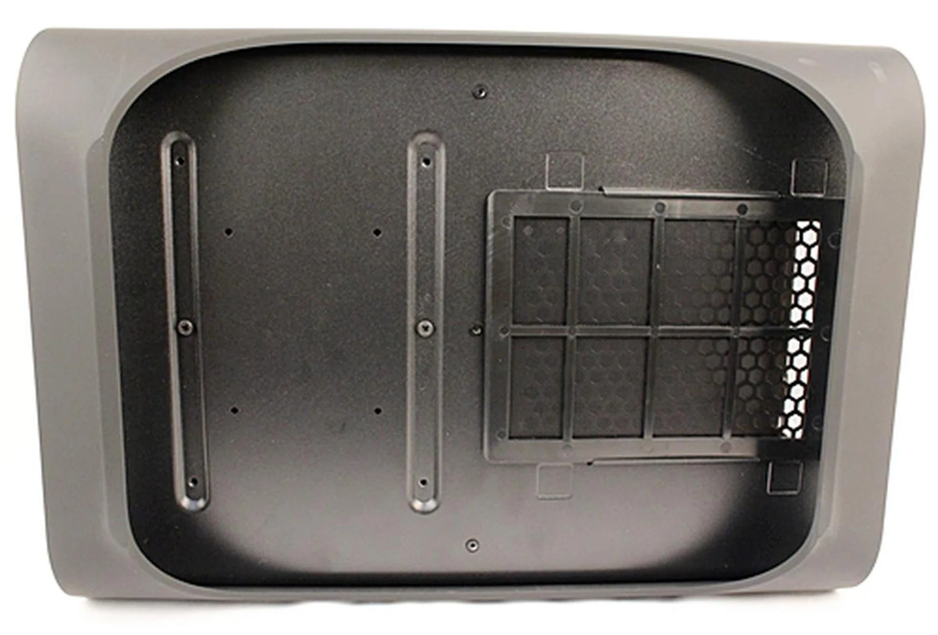After upending the chassis, we uncover the washable dust filter for the air intake vents of the PSU.