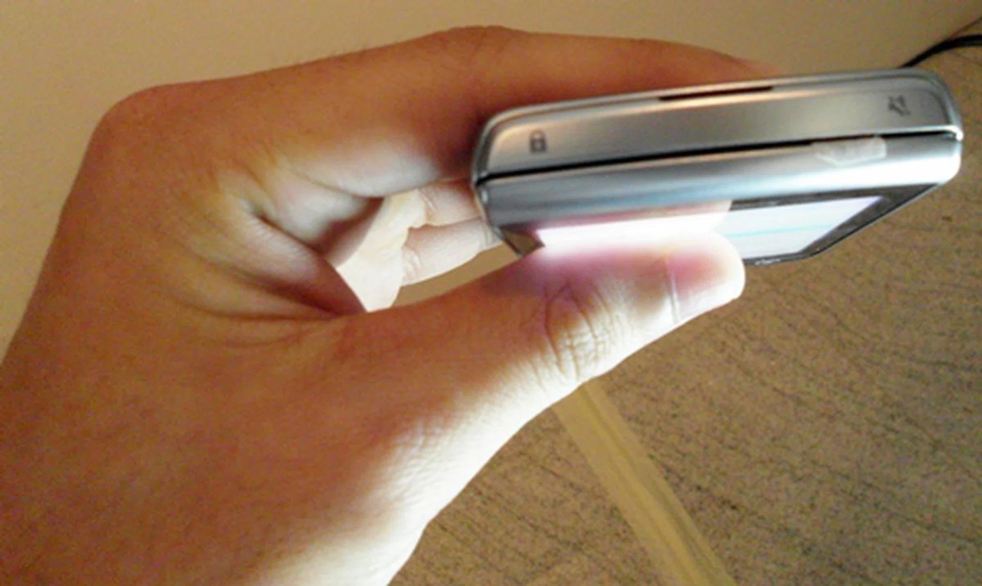 You will find the Screen Lock button and Mute button on the top side of the Torch 9810.