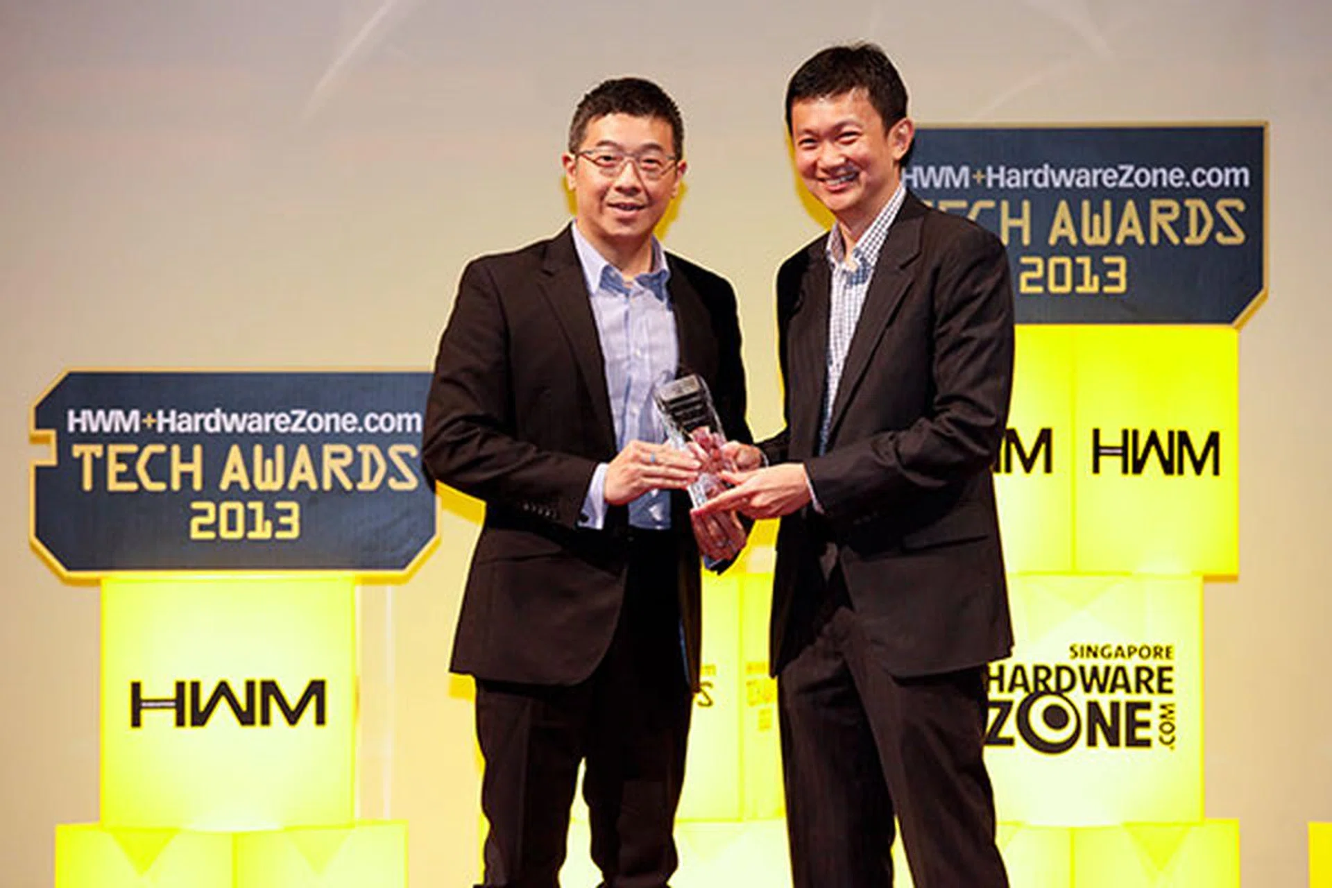 ASUS took home four awards, including Editor's Choice for Best 802.11ac Wireless Router (RT-AC66U) and Readers' Choice for Best Motherboard Brand. Here's Mr. Darwin Wu, Regional Director for OPBG, ASUS, accepting the awards.