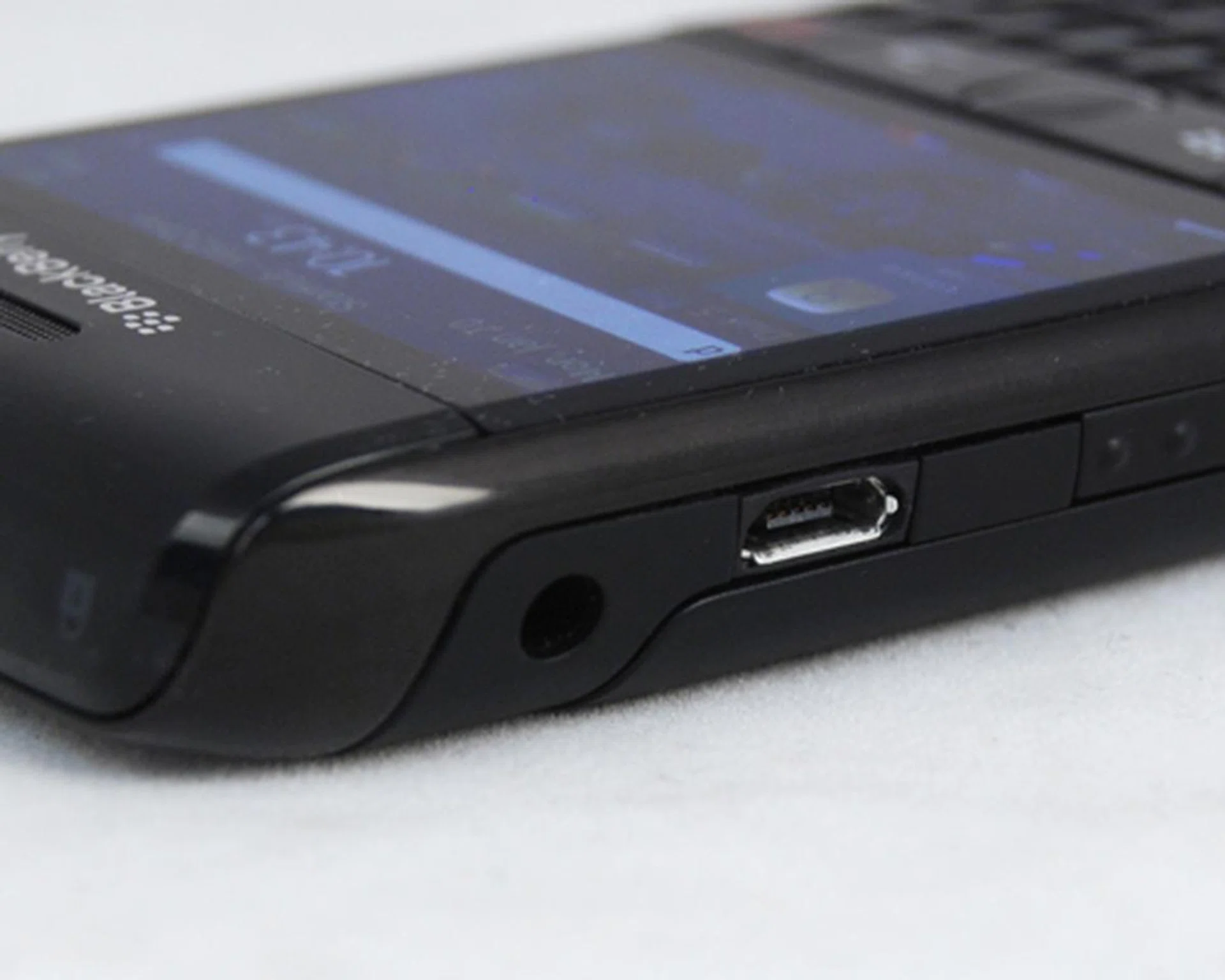 The microUSB port sits to the left, beside the voice dialer button and the 3.5mm audio jack.