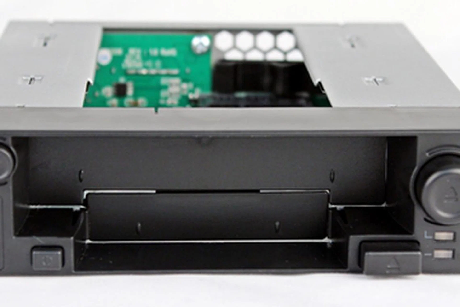 The Icy Dock DuoSwap 2.5/3.5 SATA Hot Swap Drive Caddy has four buttons for operating it after the drives are installed. The two LED lights at the lower left-hand corner will reveal the status of the drives. The 2-part dust cover prevents its innards from being exposed when any of the drives are removed.