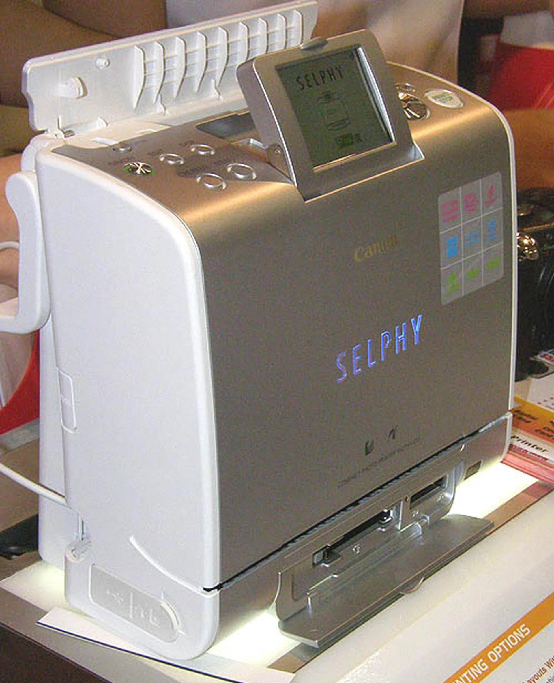  The newest addition to the Canon Selphy family of compact photo printers is the ES1, with a larger 2.5-inch LCD screen and is now selling at $399.  