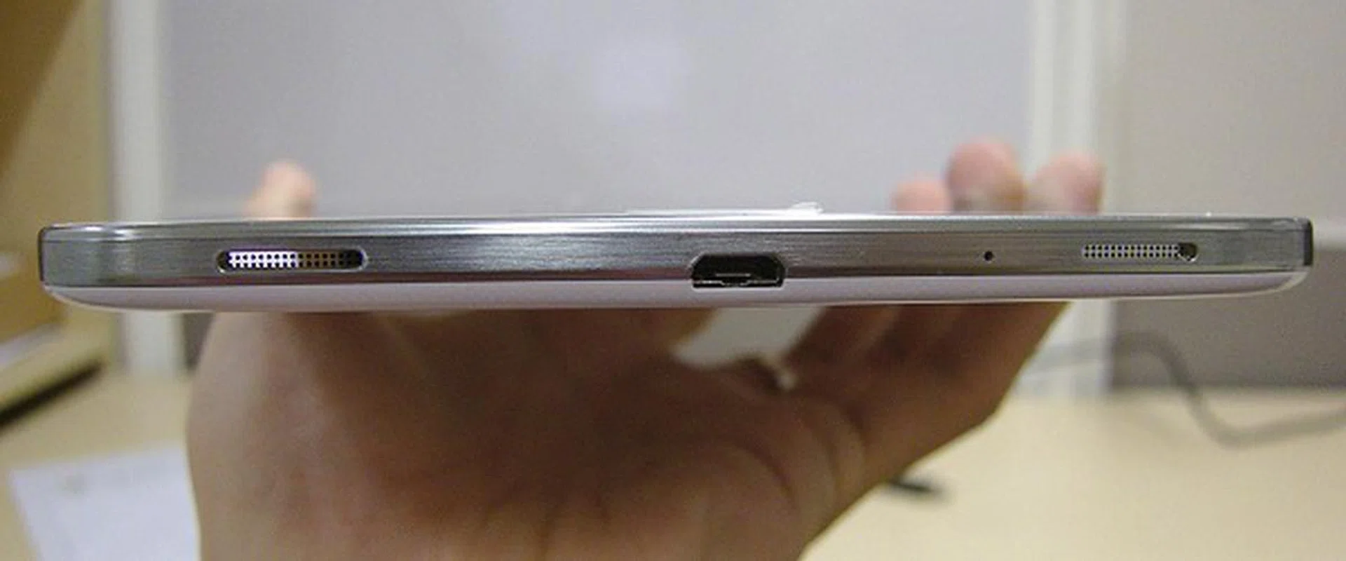 At the bottom of the tablet, you'll find the micro-USB port for data transfer and charging needs. Flanked at both ends are stereo speakers.