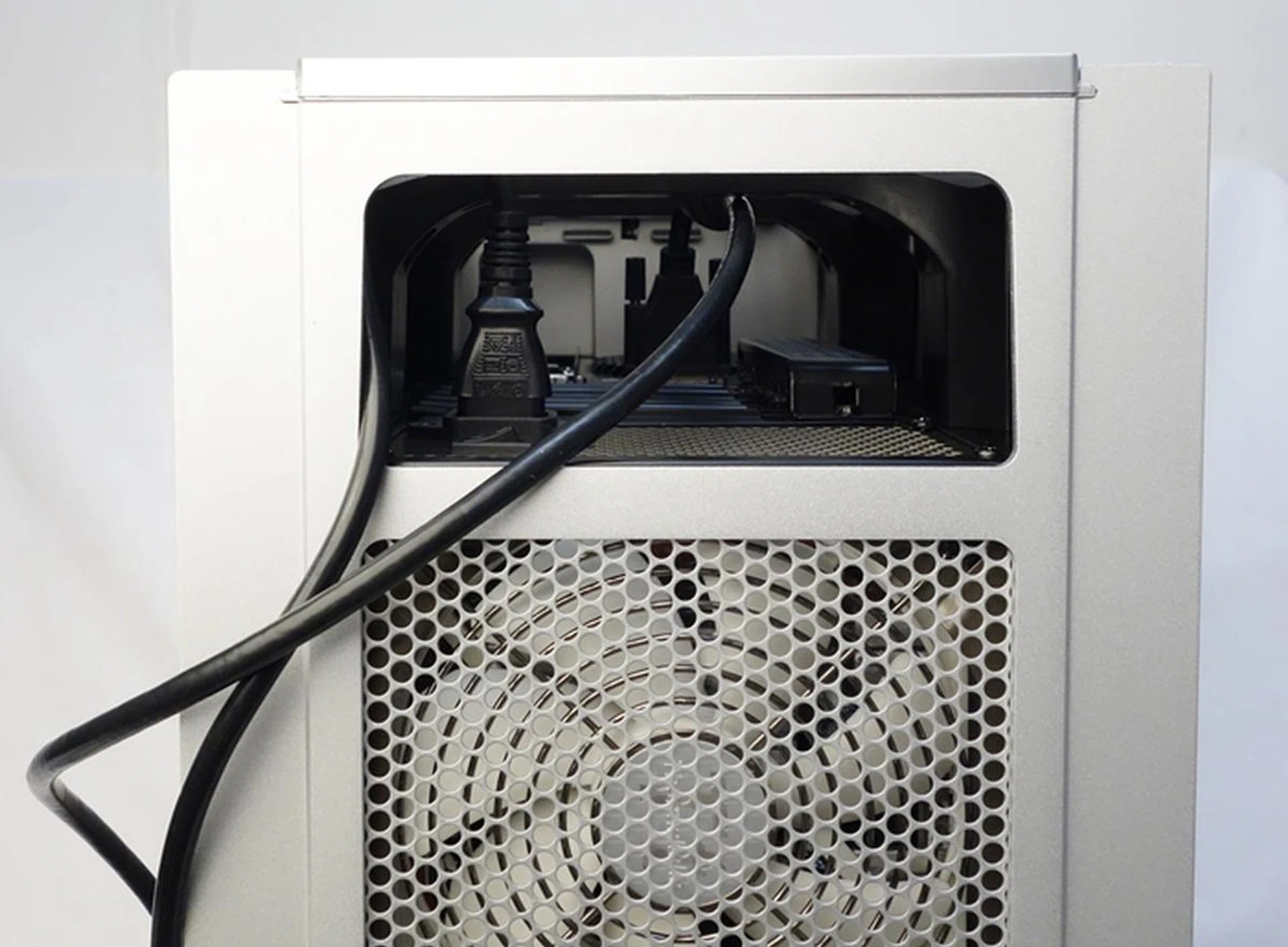 We attached a power cable and a DVI cable to see how the wires will snake out from the top recess.