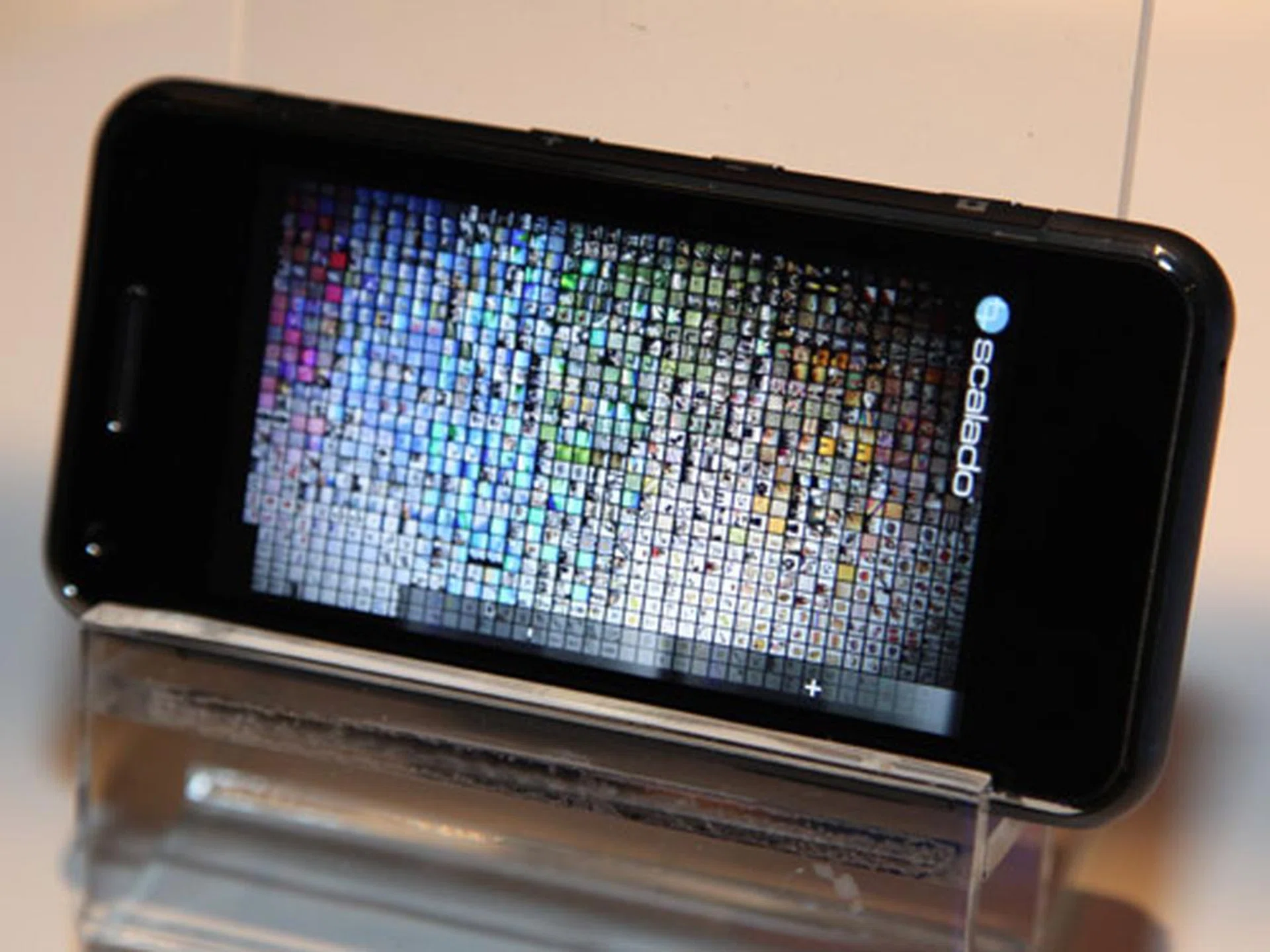 This particular demonstration shows how this photo app handles a large collection of high resolution pictures. Each tiny square in the screen is a full resolution image and the entire collage can be sorted and scaled instantly.