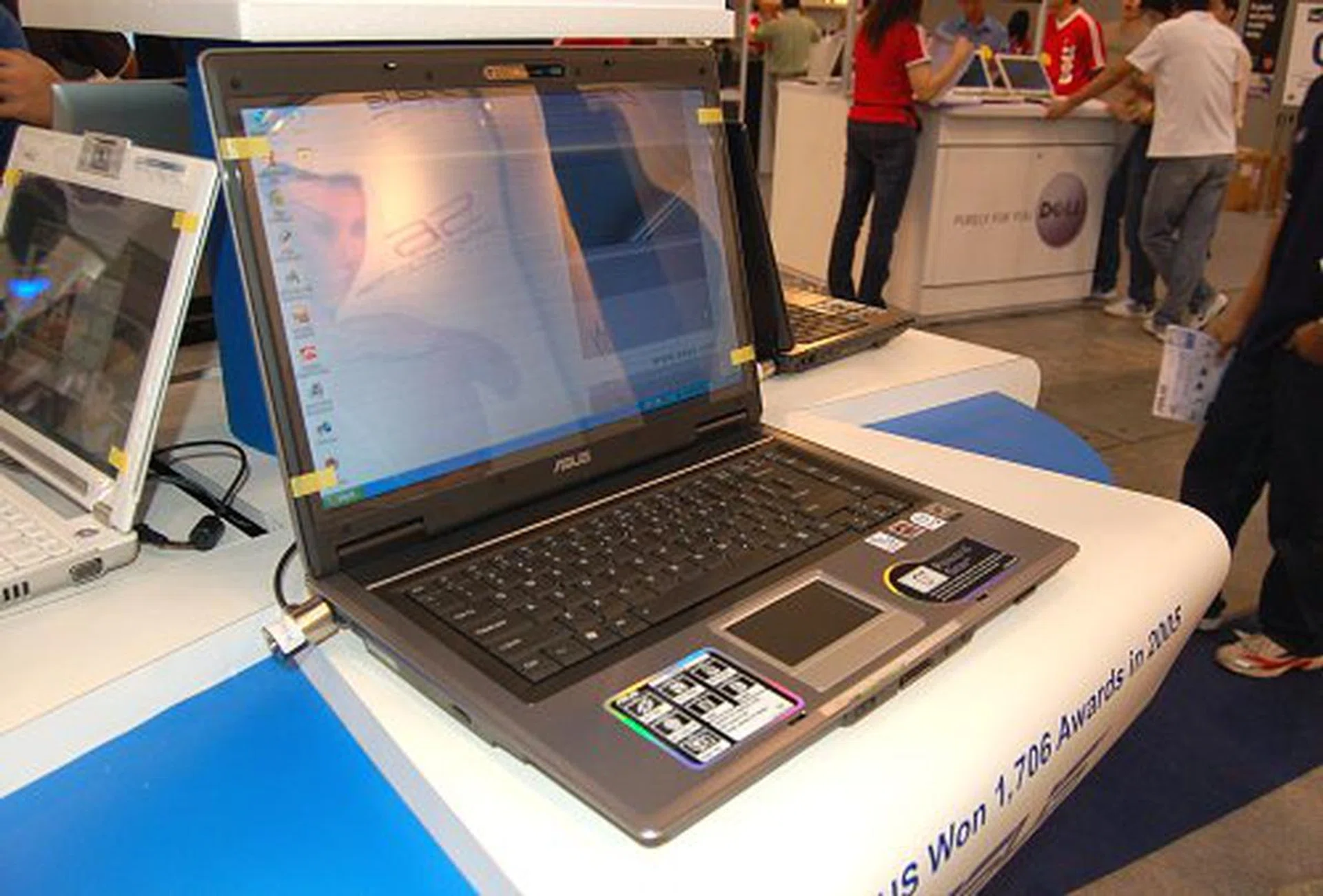 The ASUS A8 series of gaming notebooks were also on display. Models offered from the AMD Turion 64 X2 based A8M to the Intel Core 2 Duo based A8FM and A8J notebooks all come with large 14.1-inch WXGA LCDs, 512MB to 1GB of RAM and choices of Intel 945GM, NVIDIA GeForce Go 7300 or ATI Mobility Radeon X1700 GPUs. Prices range from S$1698 to S$2698.