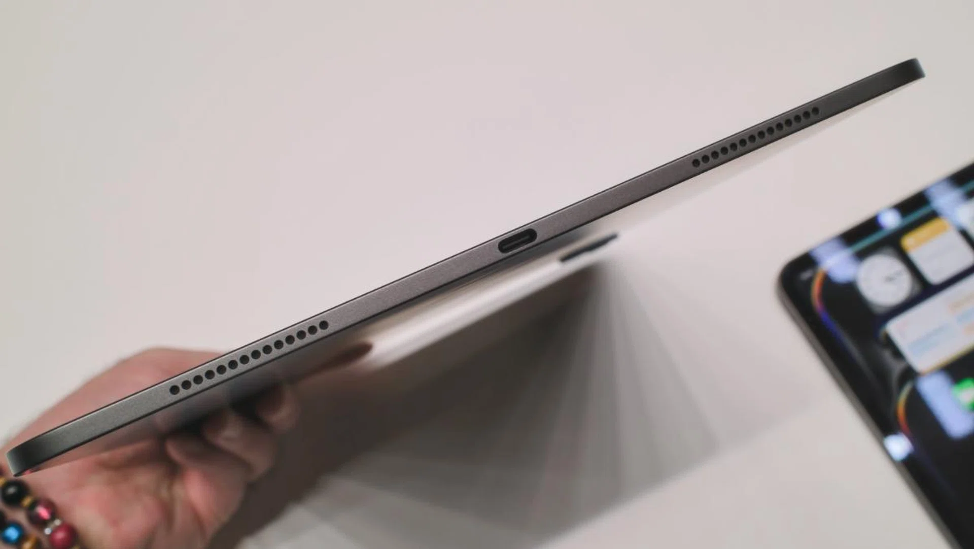 The 13-inch iPad Pro is only 5.1mm. That's 3mm or 36% thinner than the iPhone 15. The USB-C port supports Thunderbolt 3 and USB4.