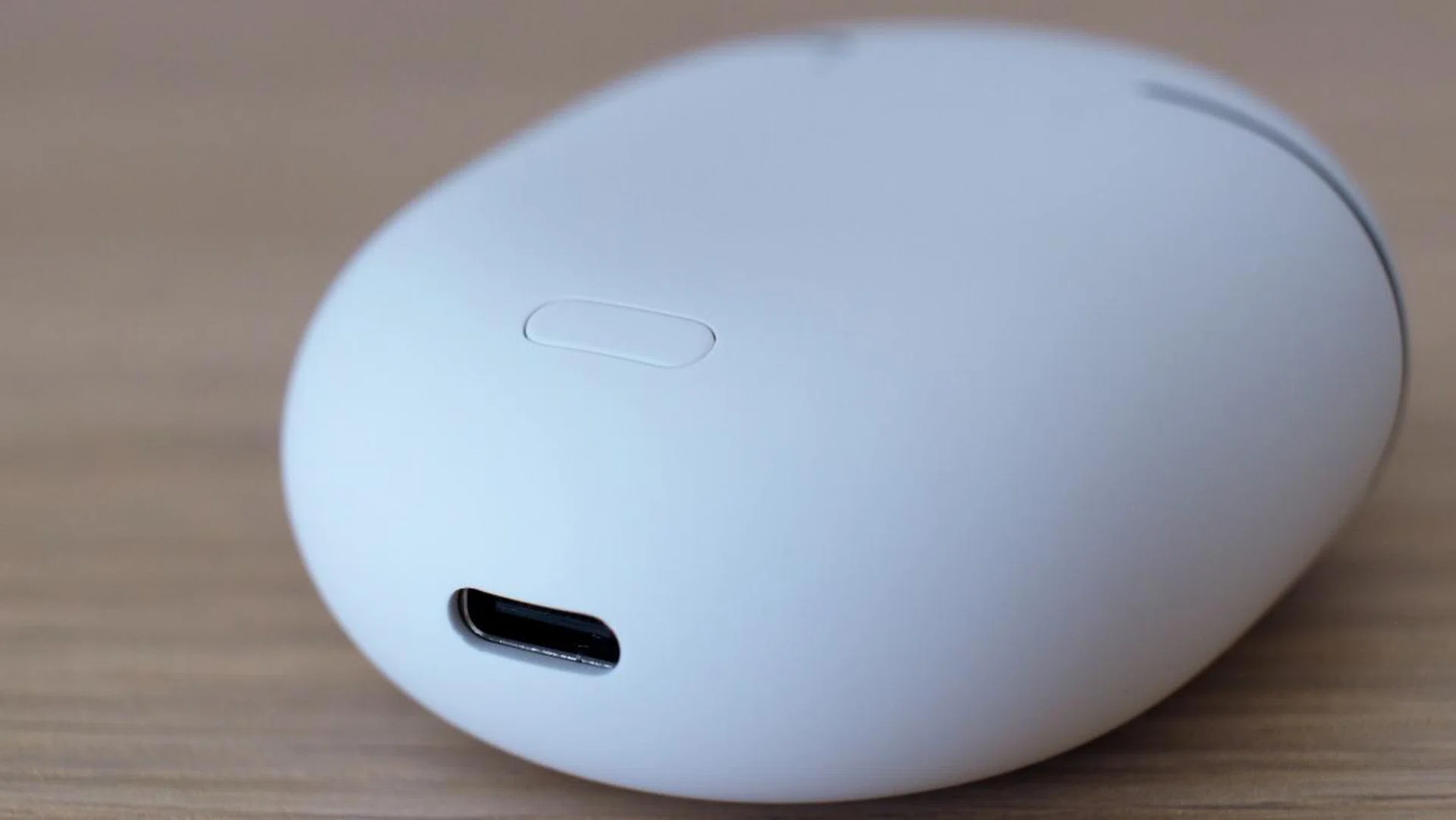 The charging case is compact and can be charged via USB-C or wirelessly with a Qi-compatible wireless charger.