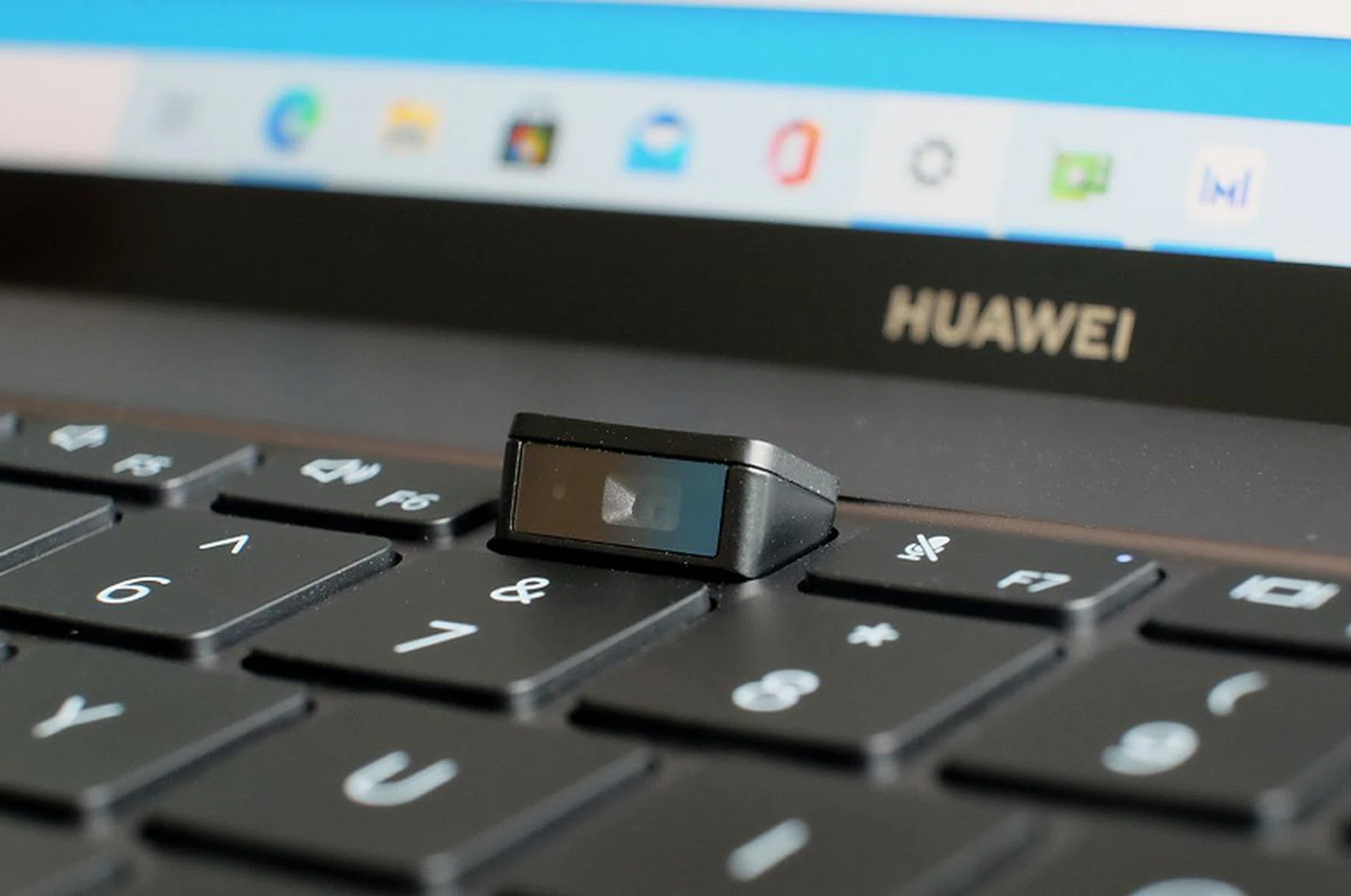 The webcam springs up from a key between F6 and F7. It shoots at 720p and the video quality is usable.