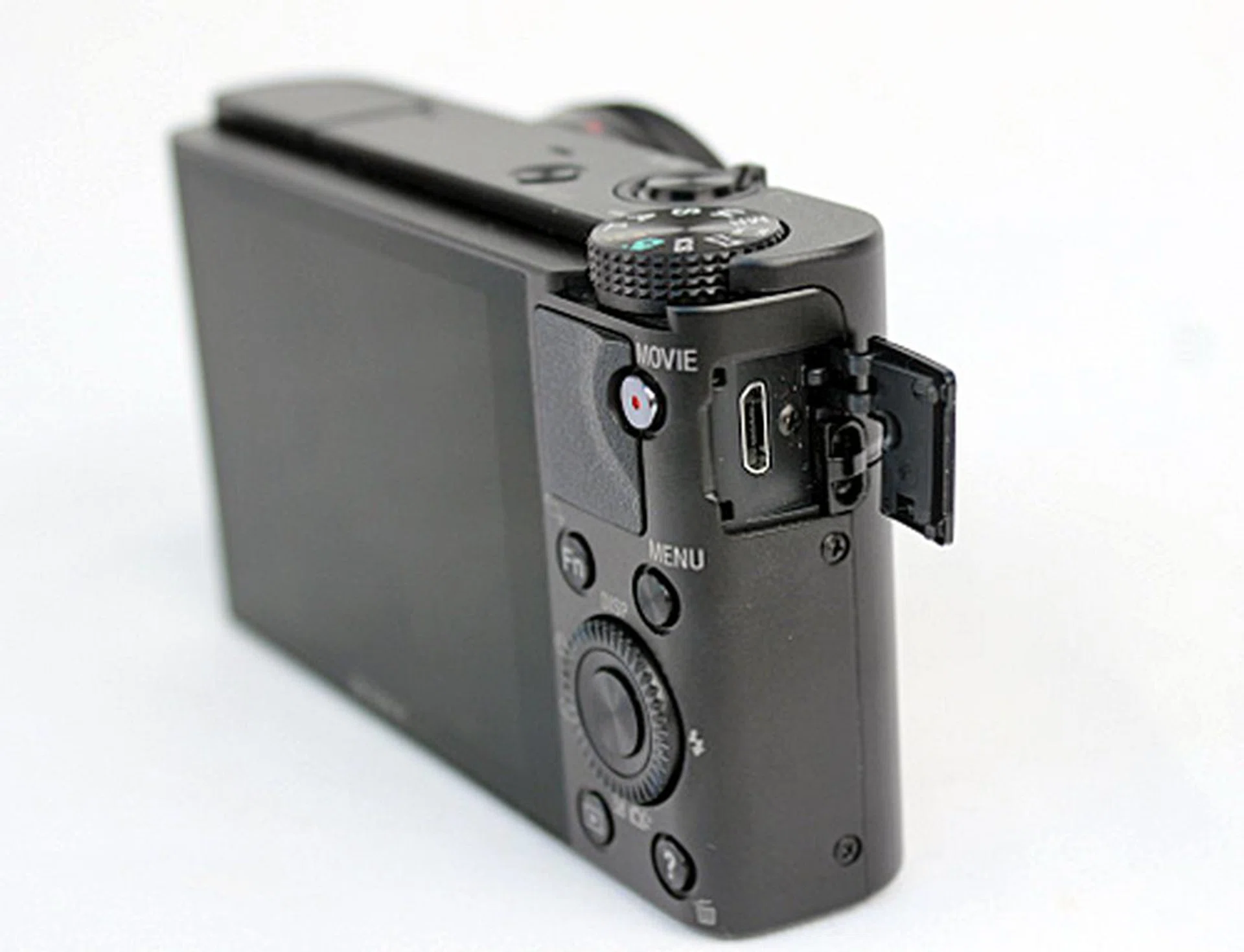 One of the flaws of the RX100's design is that the battery has to be charged in-camera via this port, which is an inconvenience as you can only charge one battery at any one time.
