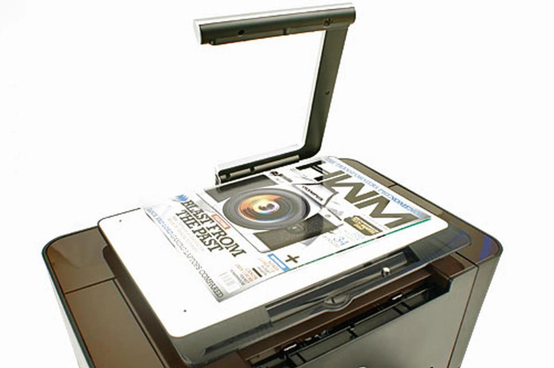 Raise the camera arm and place the item you wish to scan or copy on the white capture stage. There are alignment ridges along the edges of the surface to help in positioning. Maximum scan size is 216 x 297mm.